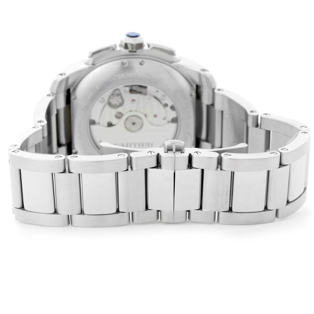 The watch is shown from the back, displaying the case back and part of the stainless steel bracelet of the Calibre de Cartier model by Cartier.