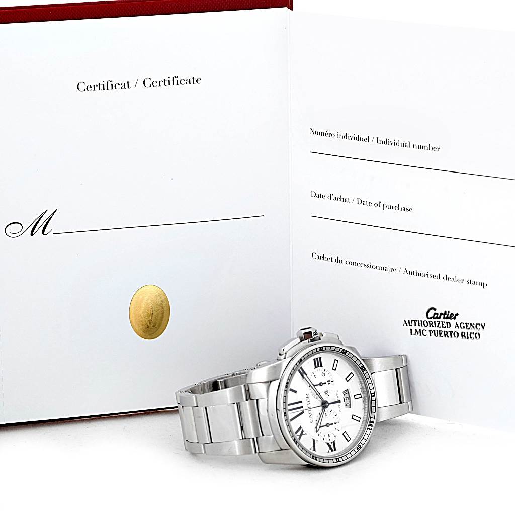 The image shows a side angle view of a Calibre de Cartier watch by Cartier, including its bracelet and partially, its certificate.