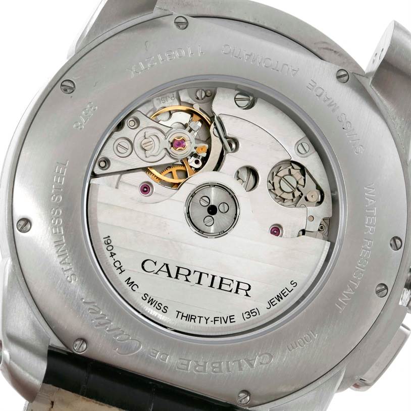 The image shows the back view of the Calibre de Cartier watch by Cartier, highlighting its internal mechanical movement.