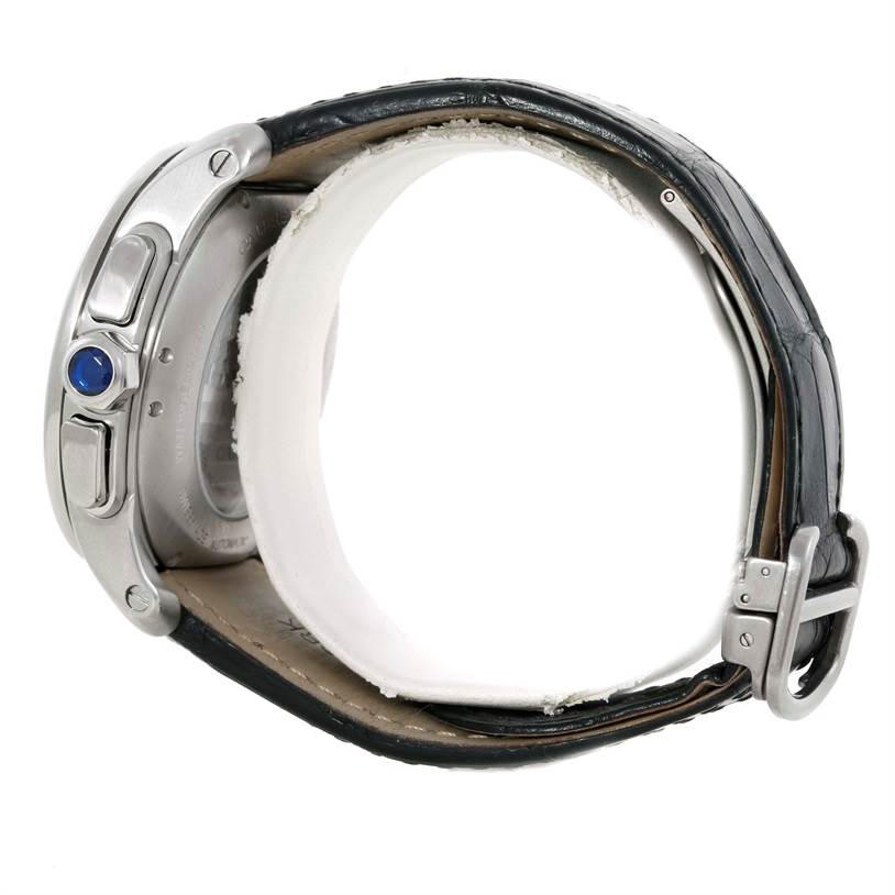 This image shows a side view of a Calibre de Cartier watch by Cartier, highlighting the crown and leather strap.