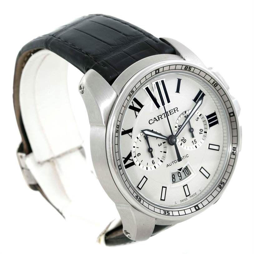 The Calibre de Cartier watch by Cartier is shown at a slight angle, highlighting the face, dial, and part of the strap.