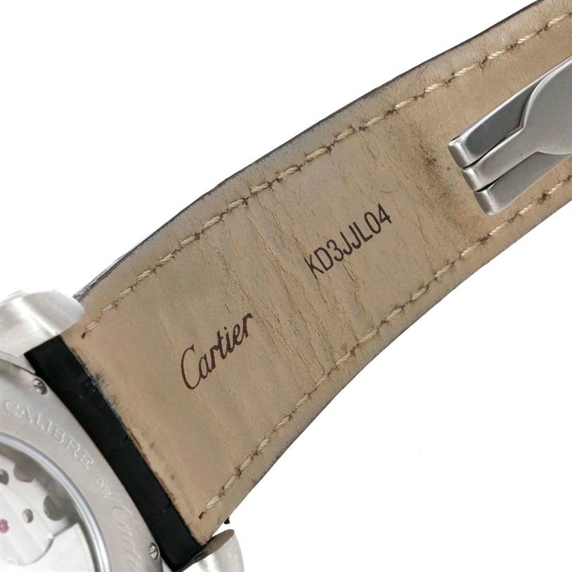 The image shows the back side of the strap and part of the underside of the case of a Calibre de Cartier watch by Cartier.