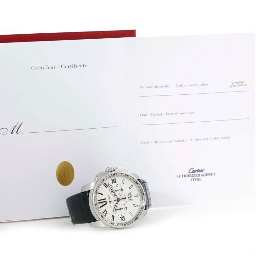 The image shows a Calibre de Cartier watch by Cartier with its face and part of the band visible, alongside a certificate.