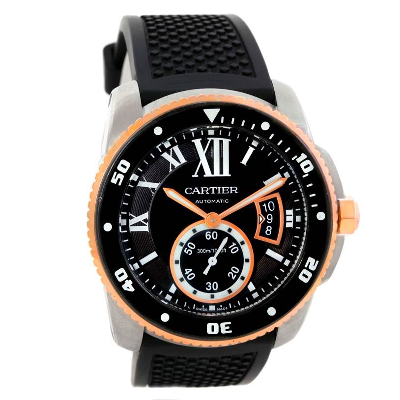 The image shows a front view of a Calibre de Cartier watch by Cartier, highlighting its dial, bezel, and rubber strap.
