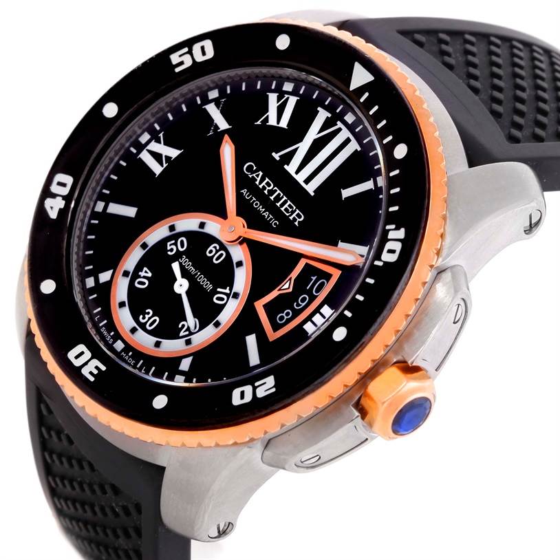 The Calibre de Cartier watch by Cartier is shown at an angle highlighting the dial, crown, and part of the rubber strap.