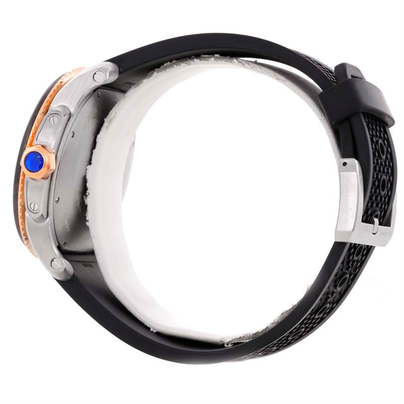 The image shows a side view of a Calibre de Cartier watch by Cartier, highlighting the crown, case, and black strap.