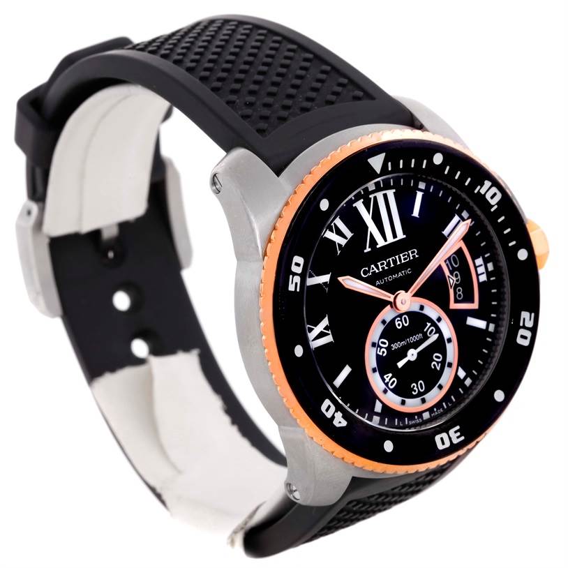 The image shows a Calibre de Cartier watch by Cartier at an angle highlighting the face, bezel, and rubber strap.