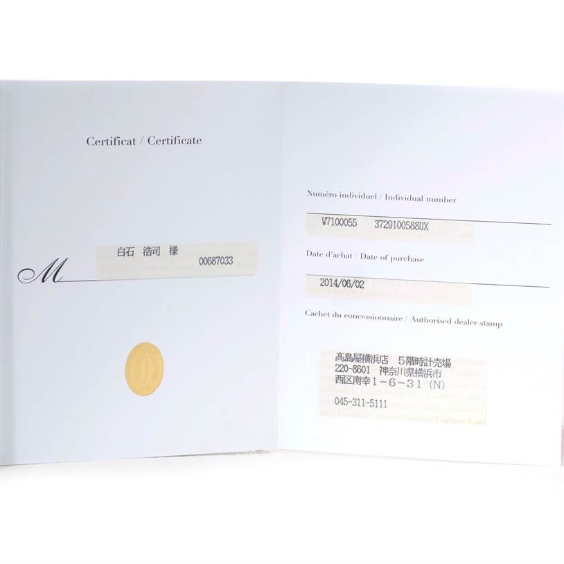 This is an open warranty or certificate booklet for a Calibre de Cartier model by Cartier, showing purchase and dealer details.