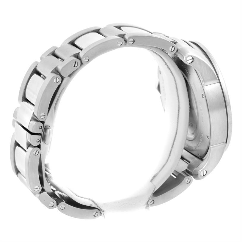 This side-angle view of the Calibre de Cartier watch by Cartier shows the bracelet and partially the case back.