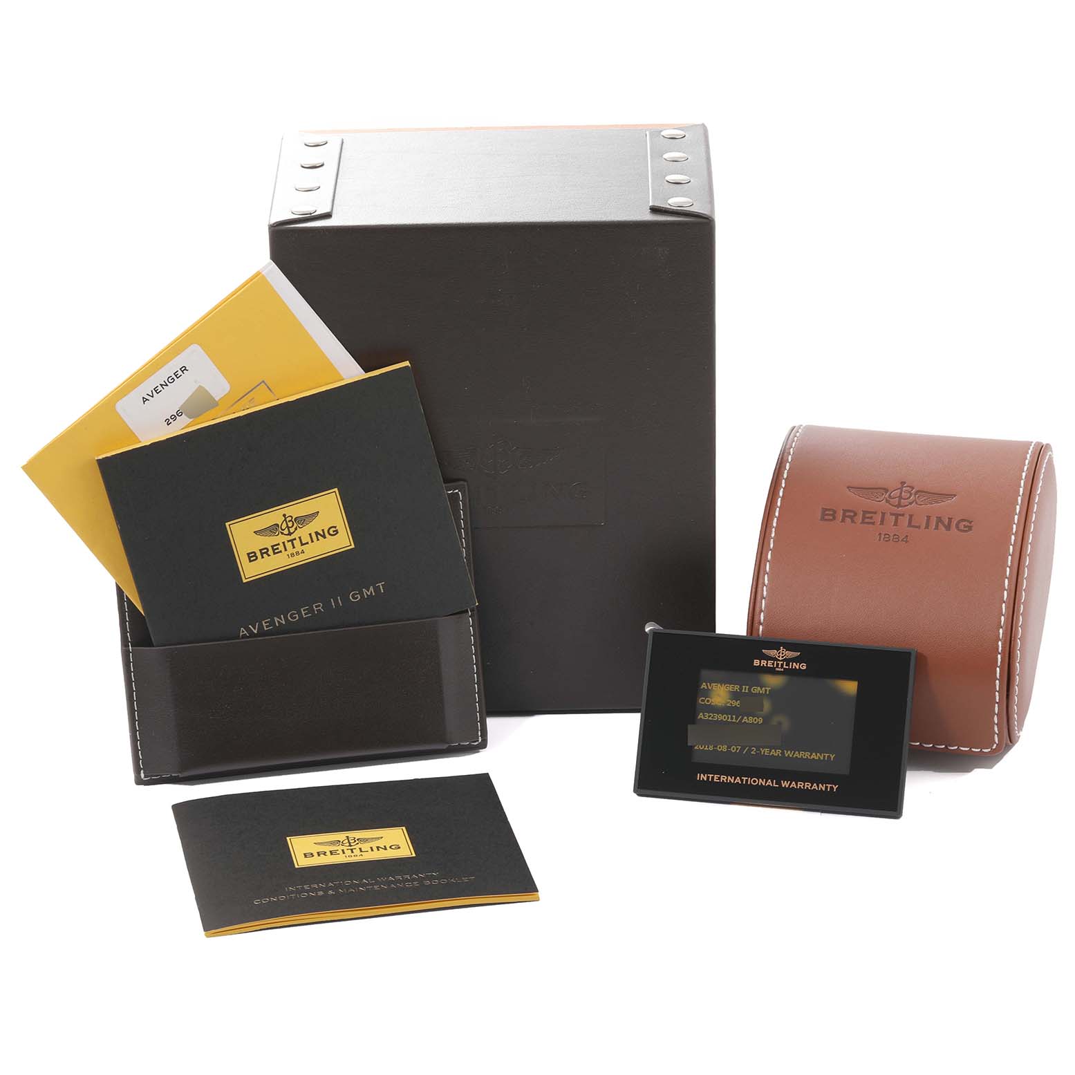 The image shows packaging and documentation for a Breitling Avenger A3239011/A809 Men's Stainless Steel Mother of Pearl Dial A3239011/A809 Men's Stainless Steel Mother of Pearl Dial model watch, including the box, warranty card, and booklets.