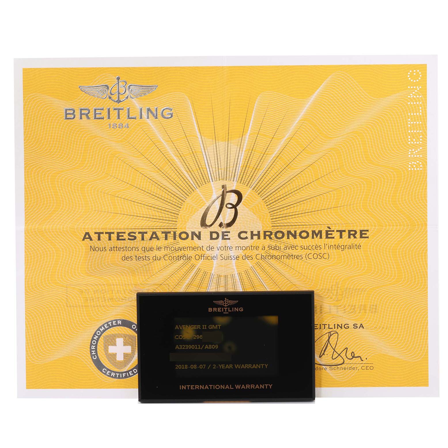 The image shows the Breitling Avenger A3239011/A809 Men's Stainless Steel Mother of Pearl Dial A3239011/A809 Men's Stainless Steel Mother of Pearl Dial model's chronometer certificate and international warranty card.
