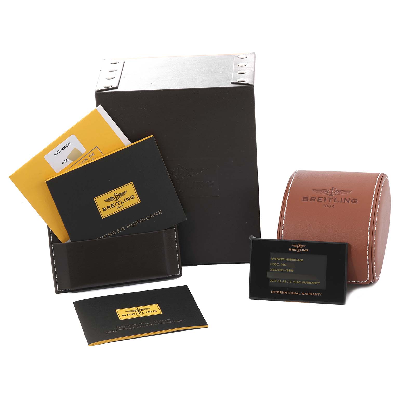 The image shows the packaging and accessories for the Breitling Avenger XB1210E4/BE89 Men's Titanium Black Dial XB1210E4/BE89 Men's Titanium Black Dial model, including a box, manual, warranty card, and travel case.