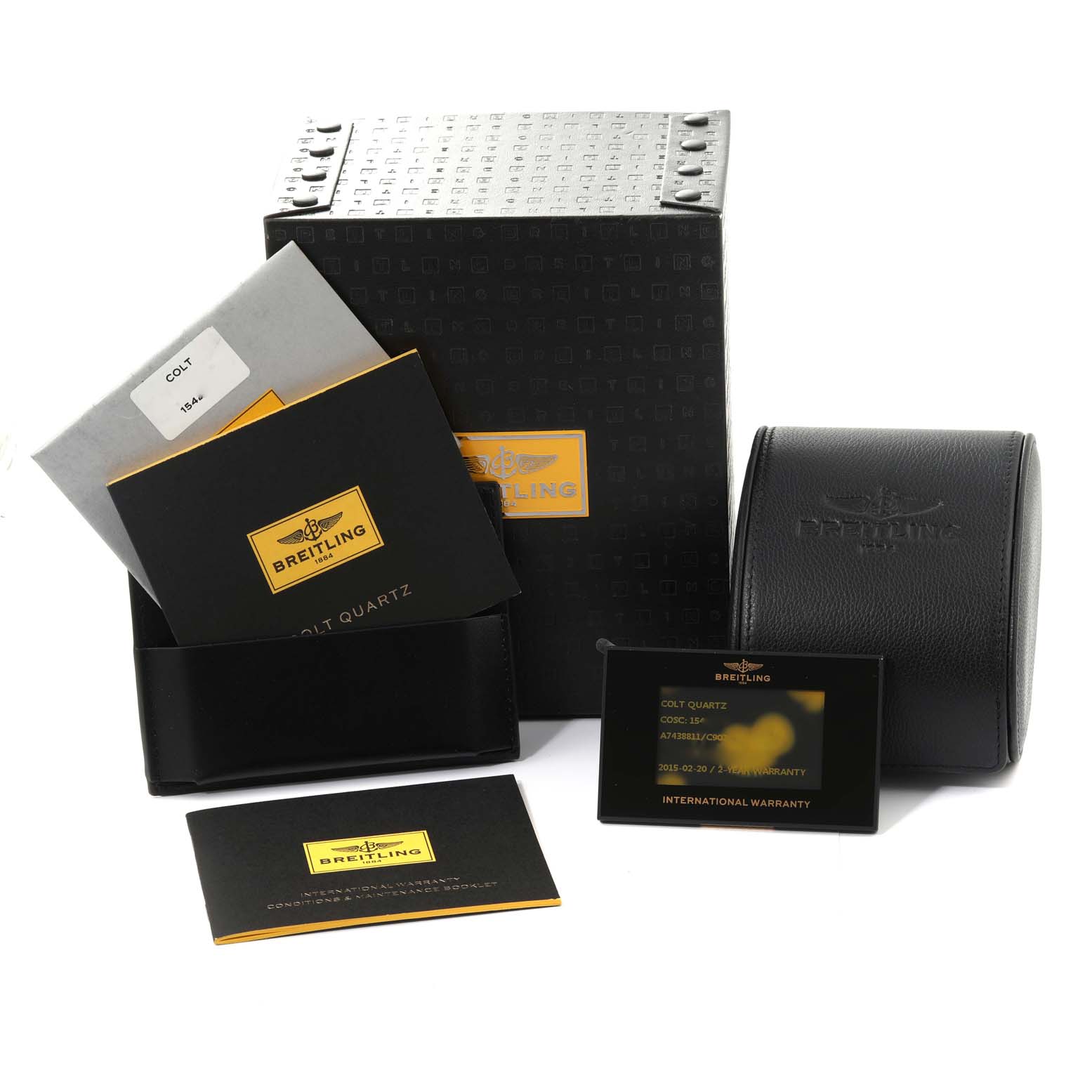 The image shows packaging and accessories for the Breitling Colt A74388 Men's Stainless Steel Blue Dial A74388 Men's Stainless Steel Blue Dial model, including its box, manuals, warranty card, and a leather pouch.