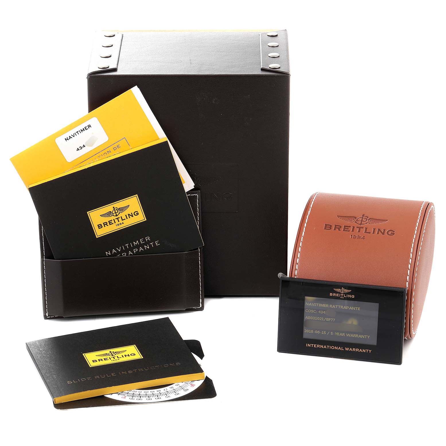 The image shows the packaging and accessories of a Breitling Navitimer AB0310 Men's Stainless Steel Black Dial AB0310 Men's Stainless Steel Black Dial, including the box, manuals, warranty card, and watch case.