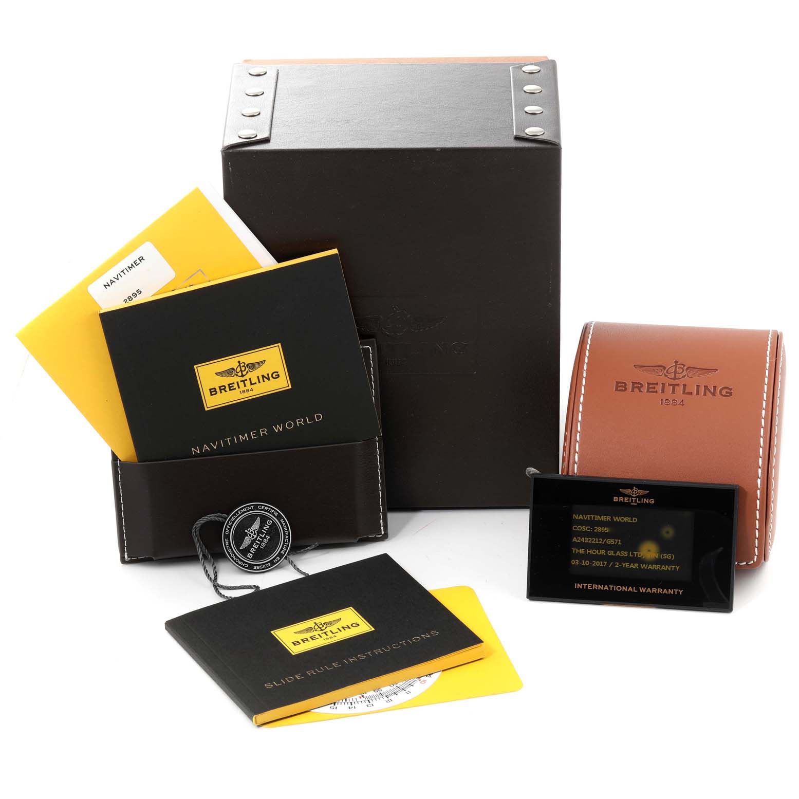 The image shows packaging, booklets, and warranty card for the Breitling Navitimer A24322 Men
s Stainless Steel Silver Dial A24322 Men
s Stainless Steel Silver Dial watch model.
