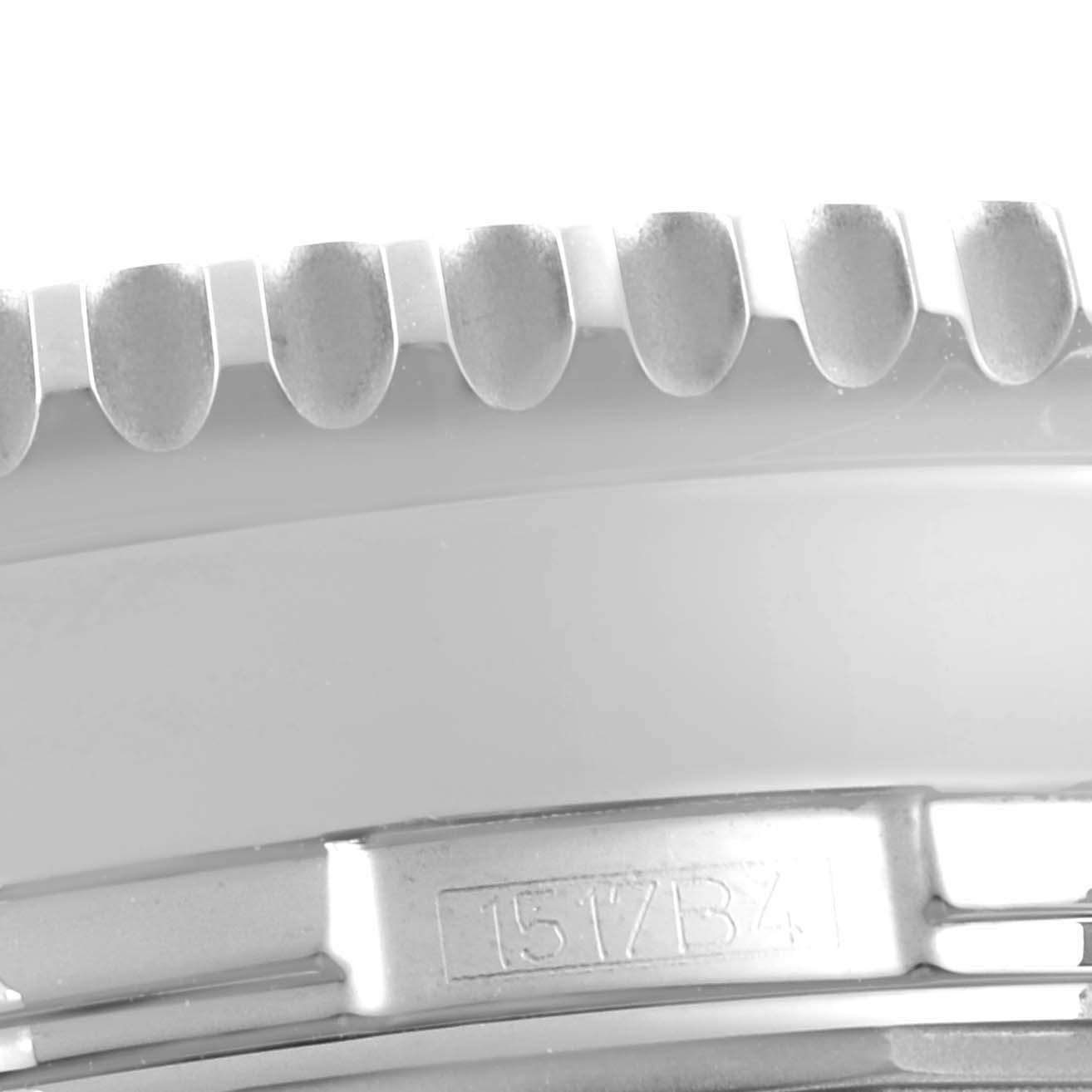 The image shows a close-up of the bezel and part of the case of the Breitling Navitimer A24322 Men
s Stainless Steel Silver Dial A24322 Men
s Stainless Steel Silver Dial watch.