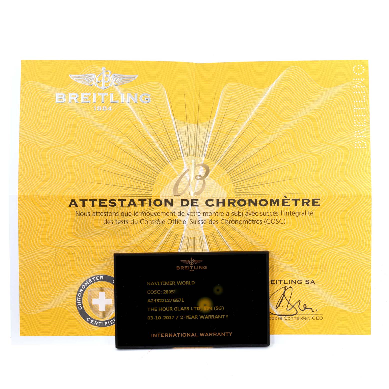 The image shows a Breitling Navitimer A24322 Men
s Stainless Steel Silver Dial A24322 Men
s Stainless Steel Silver Dial model
s chronometer certificate and international warranty card.