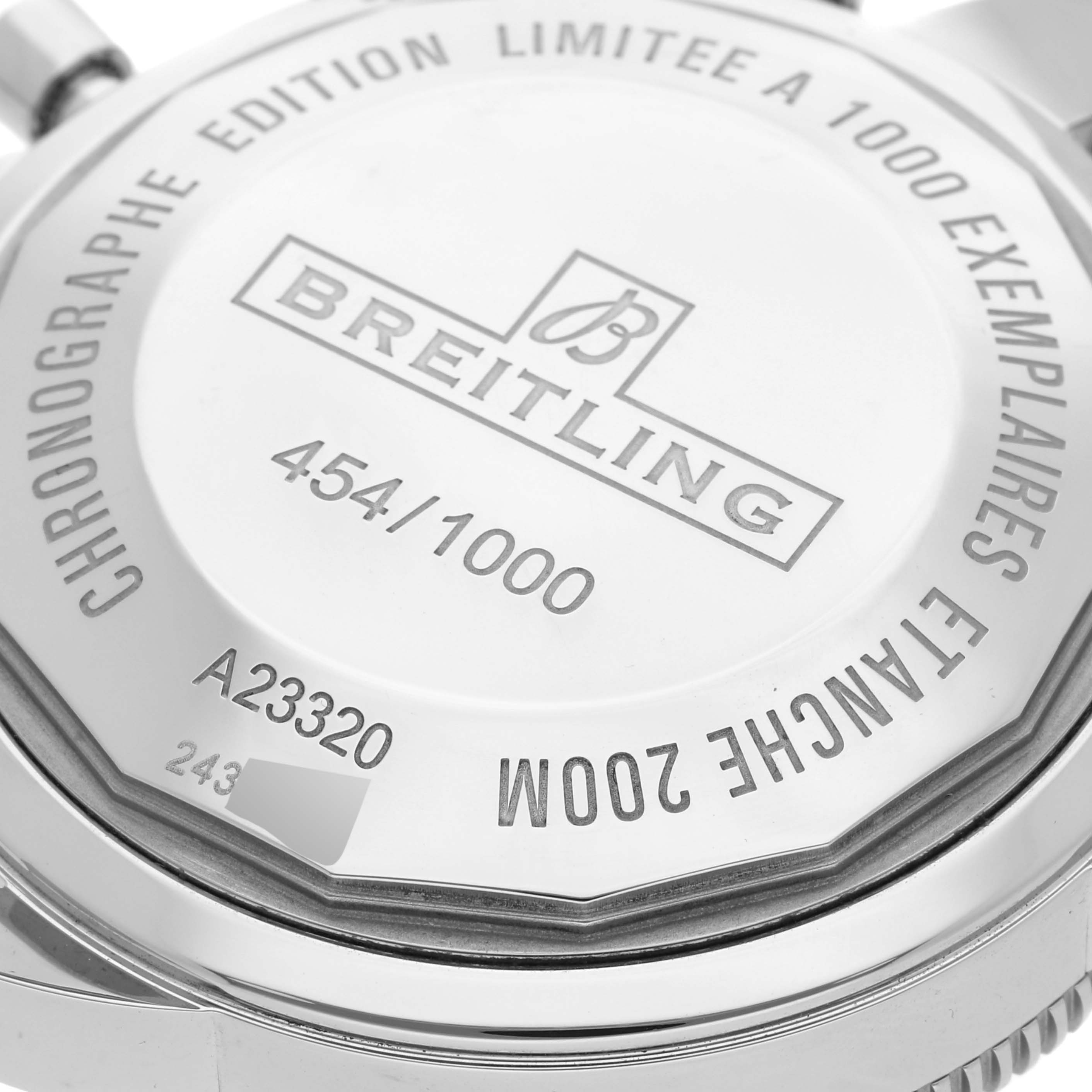 The image shows the back case of a Breitling Limited Series model, highlighting the serial number and water resistance information.