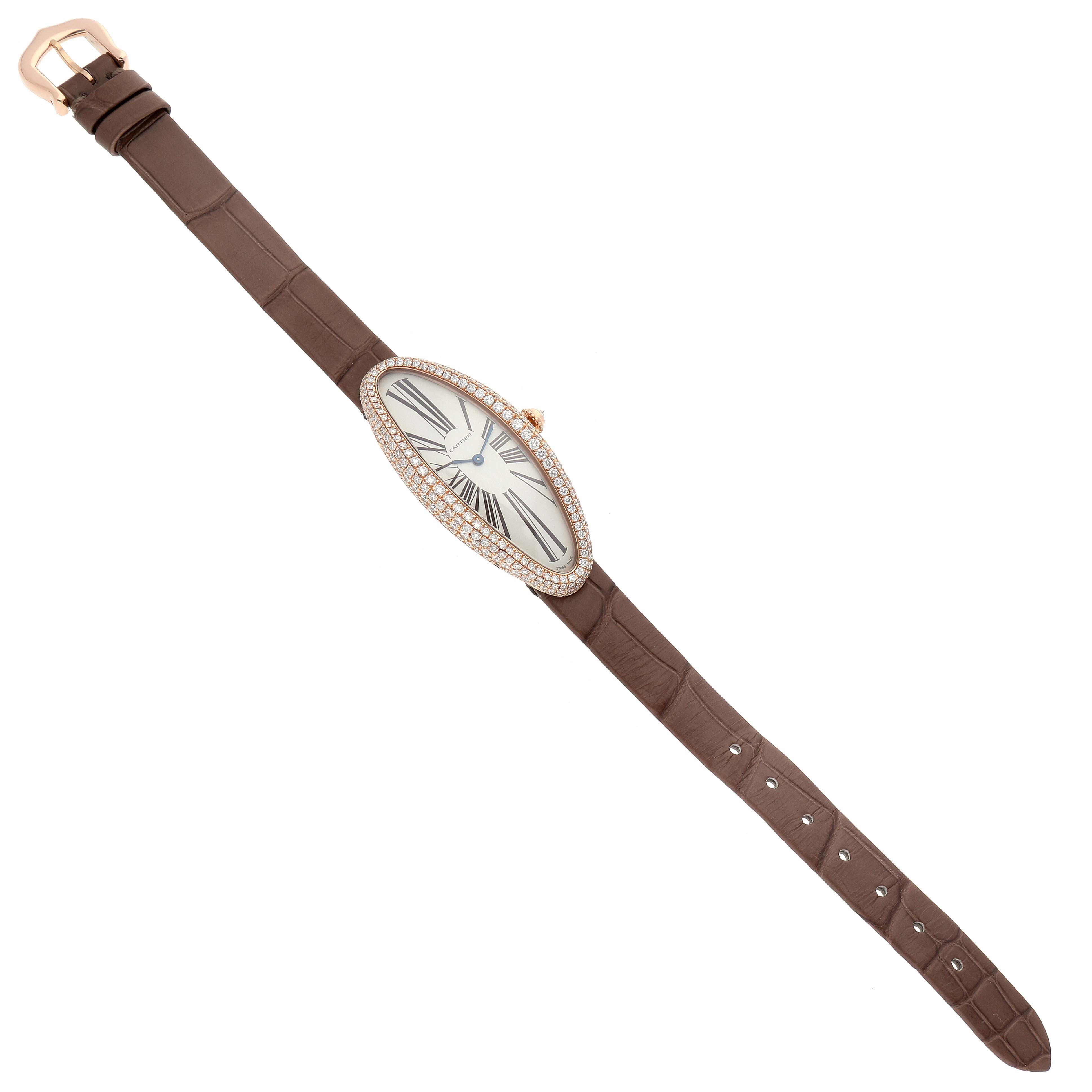 This image shows a Cartier Baignoire WJBA0006 Women's Rose Gold White Dial WJBA0006 Women's Rose Gold White Dial watch from a top-down angle, displaying its entire strap and face.