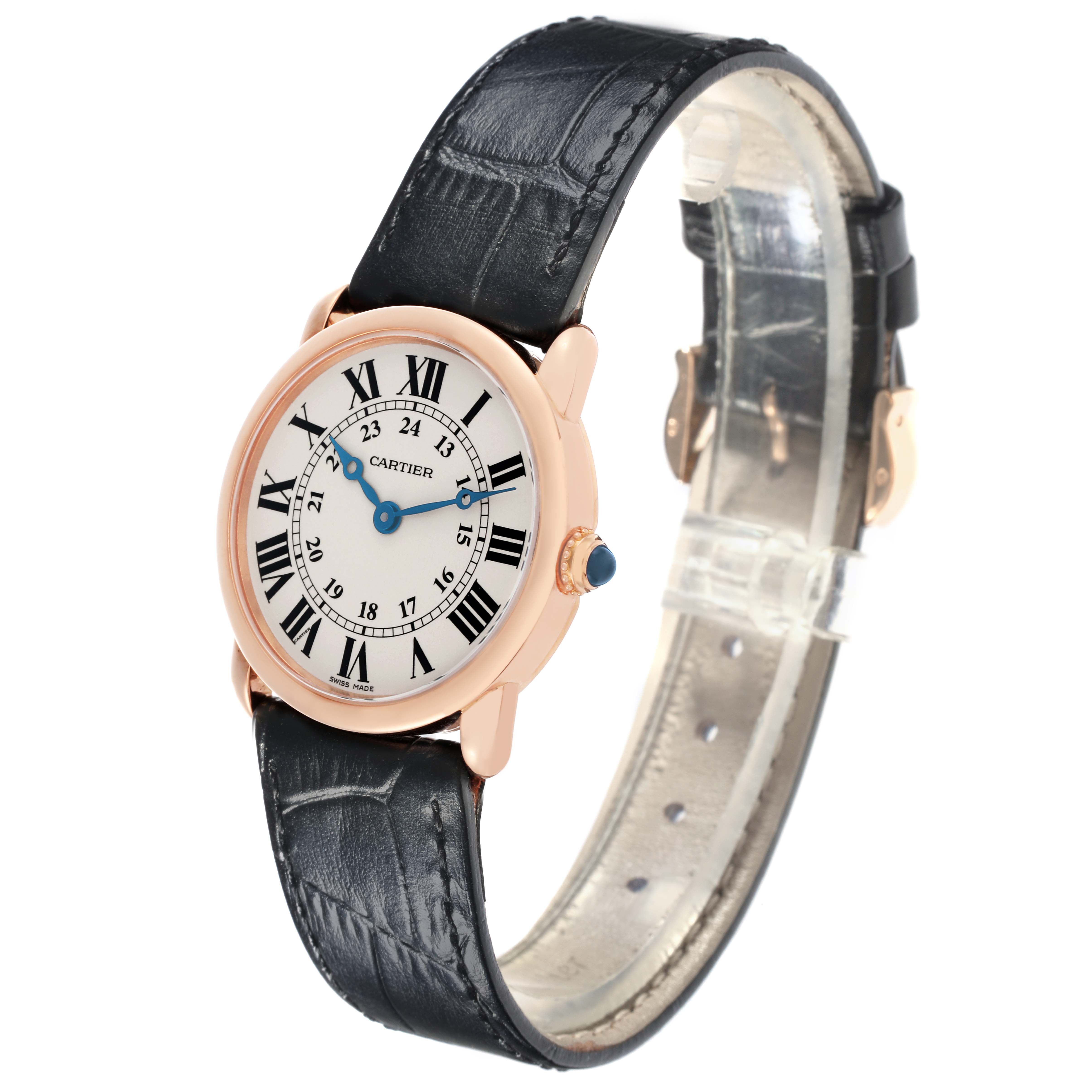 The Cartier Ronde W6800151 Women's Rose Gold Silver Dial W6800151 Women's Rose Gold Silver Dial watch is shown at a three-quarter angle, displaying the face, case, crown, and partially opened leather strap.