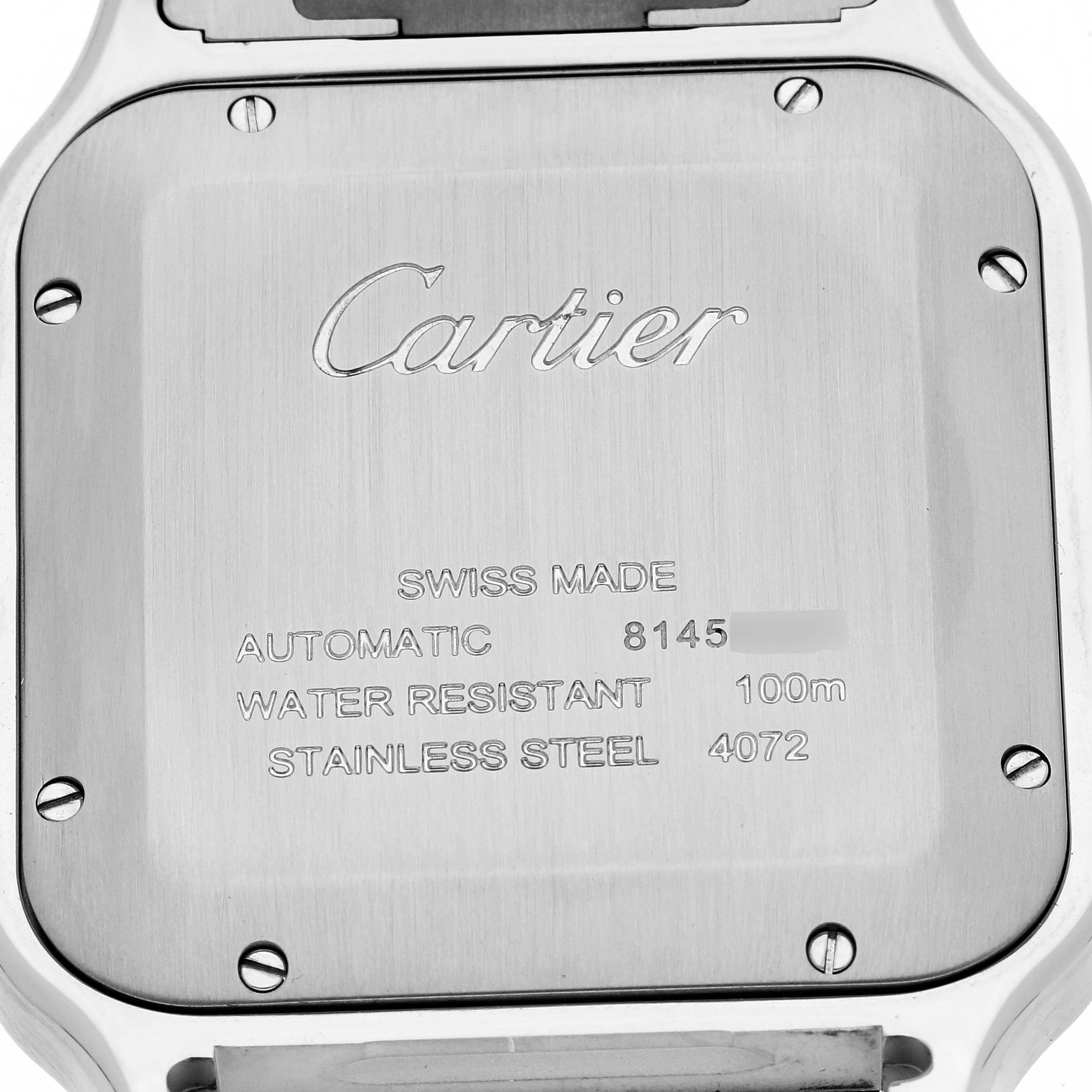 The image shows the back case of a Cartier Santos W2SA0009 Men
s Stainless Steel Silver Dial W2SA0009 Men
s Stainless Steel Silver Dial watch with engravings detailing specifications.