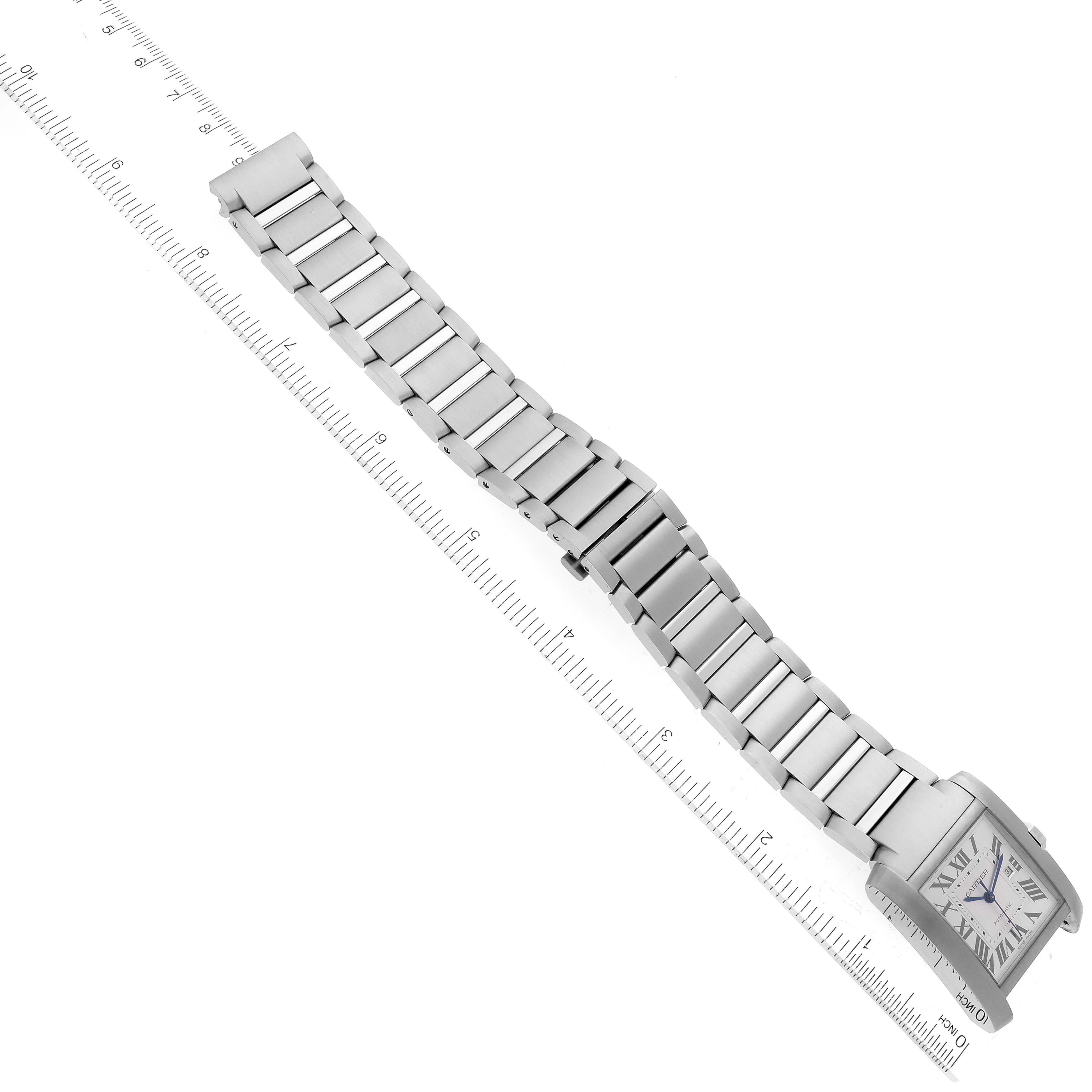 The image shows a Cartier Tank Francaise WSTA0067 Men
s Stainless Steel Silver Dial WSTA0067 Men
s Stainless Steel Silver Dial watch laid flat with a ruler measuring its length.