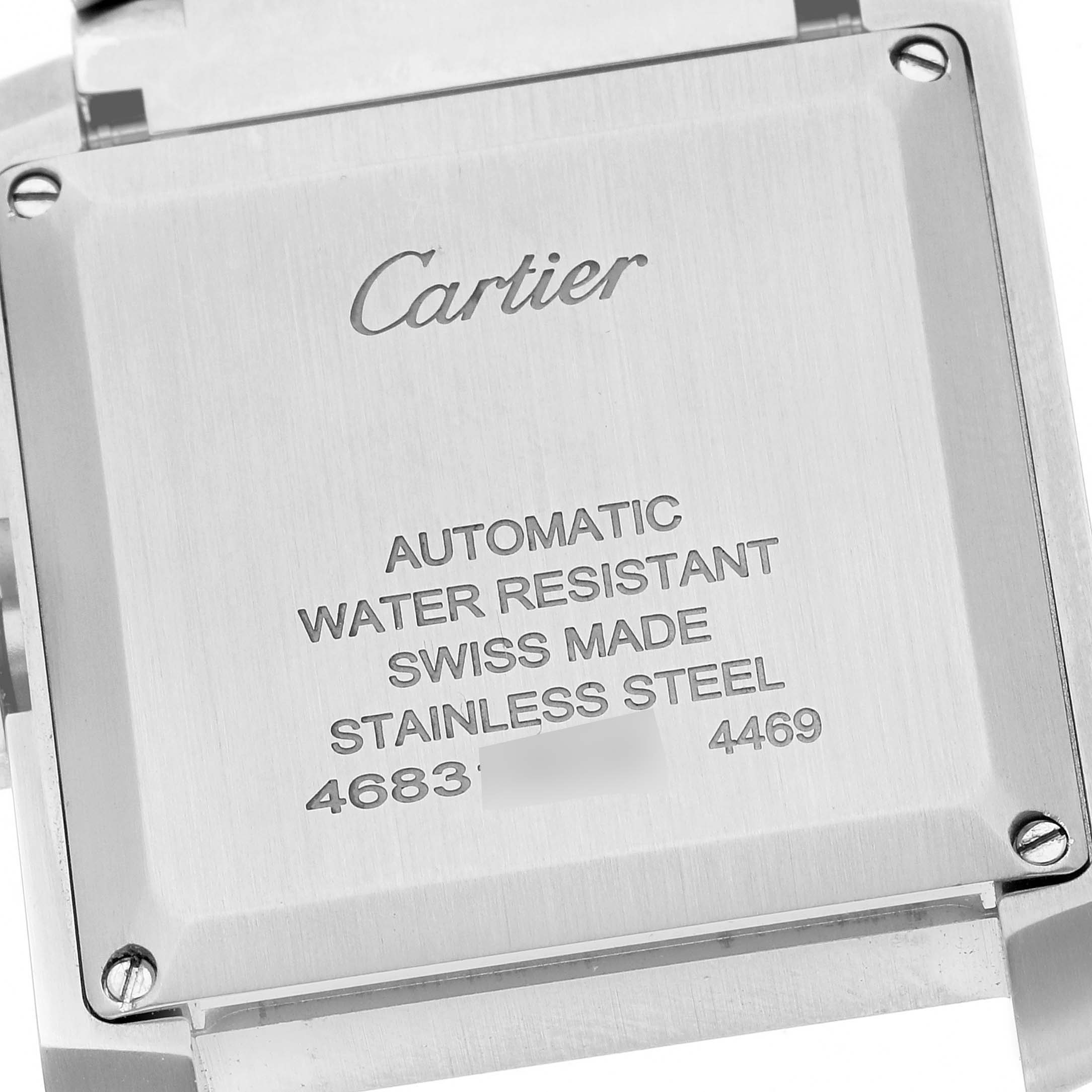 This is a close-up view of the case back of a Cartier Tank Francaise WSTA0067 Men
s Stainless Steel Silver Dial WSTA0067 Men
s Stainless Steel Silver Dial watch, showing engraved text and screws.