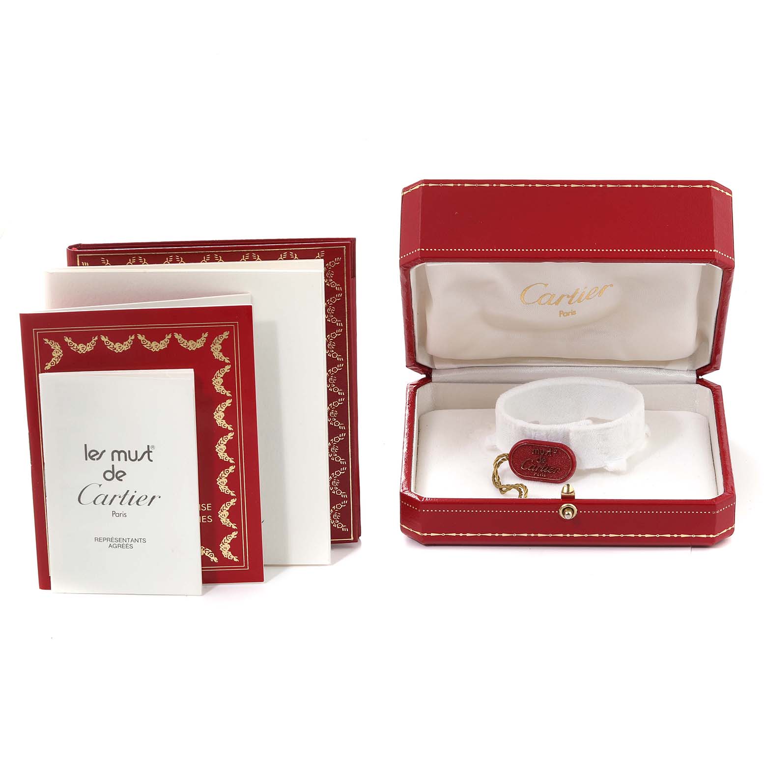 The image shows the packaging, tag, and documentation for a Cartier Tank Française watch.