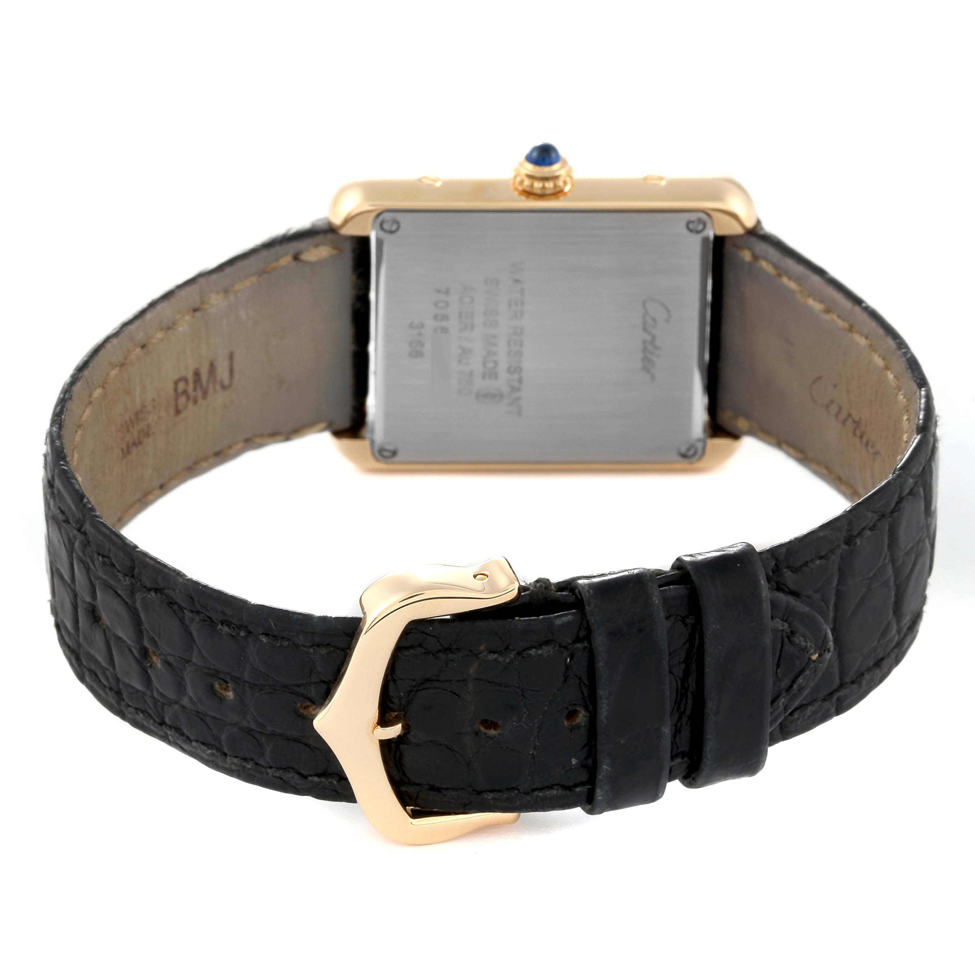 The image shows the back view of a Cartier Tank Solo W5200002 Women
s Steel and Gold (two tone) Silver Dial W5200002 Women
s Steel and Gold (two tone) Silver Dial watch, displaying the case back, strap, and buckle.