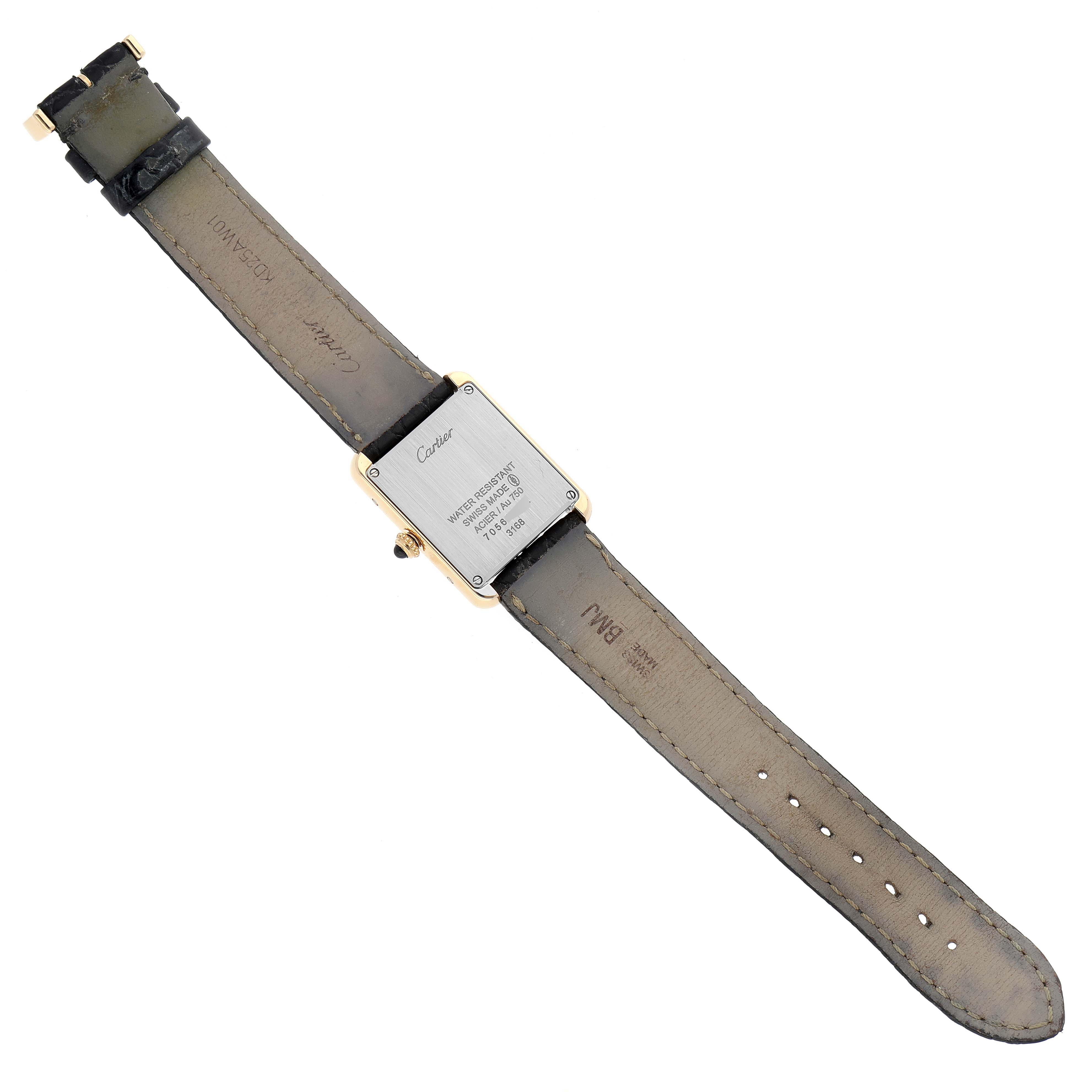 The image shows the back of a Cartier Tank Solo W5200002 Women
s Steel and Gold (two tone) Silver Dial W5200002 Women
s Steel and Gold (two tone) Silver Dial watch laid flat, highlighting the strap and case back.