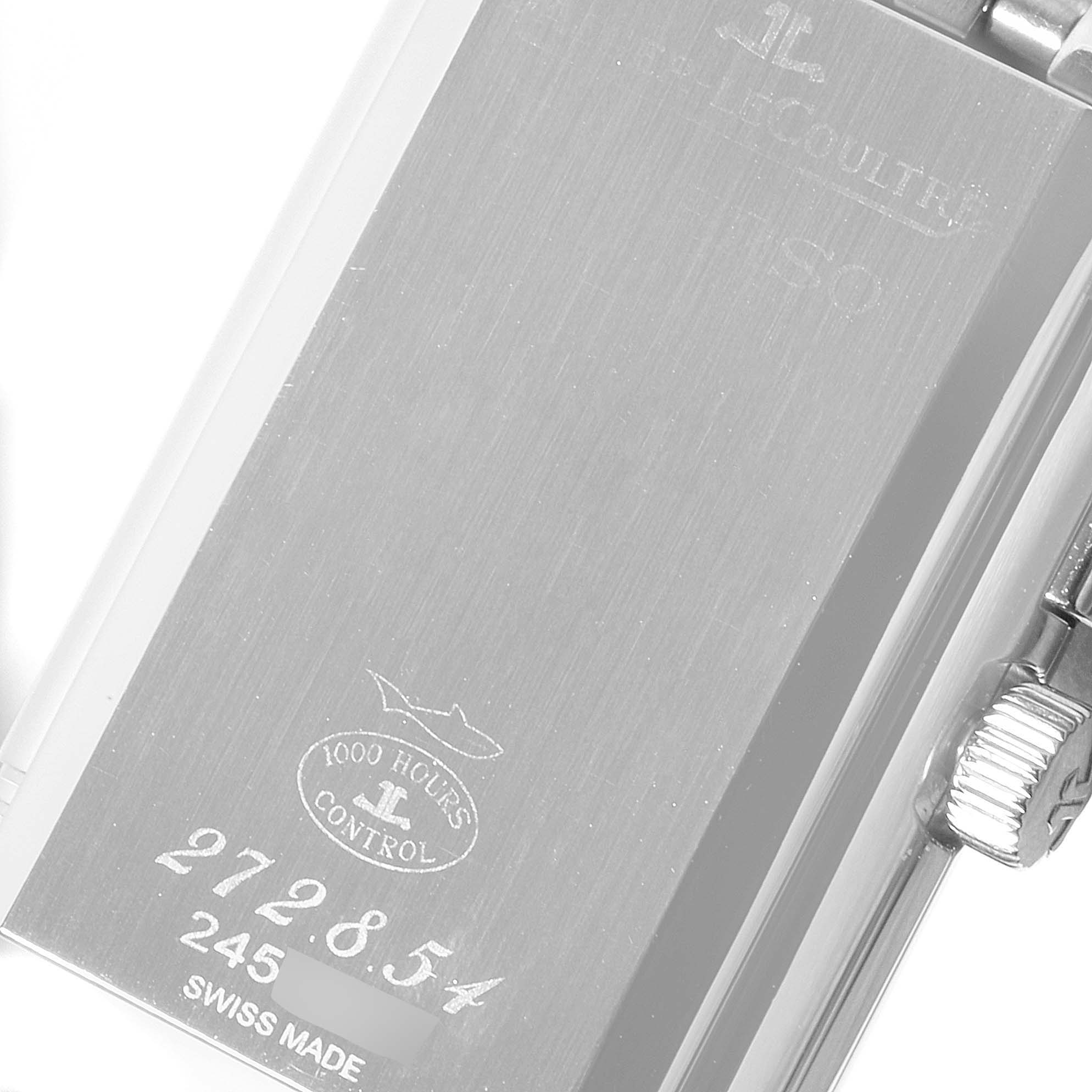 The image shows the back case and crown of a Jaeger-LeCoultre Reverso watch, highlighting branding, serial numbers, and "1000 Hours Control."