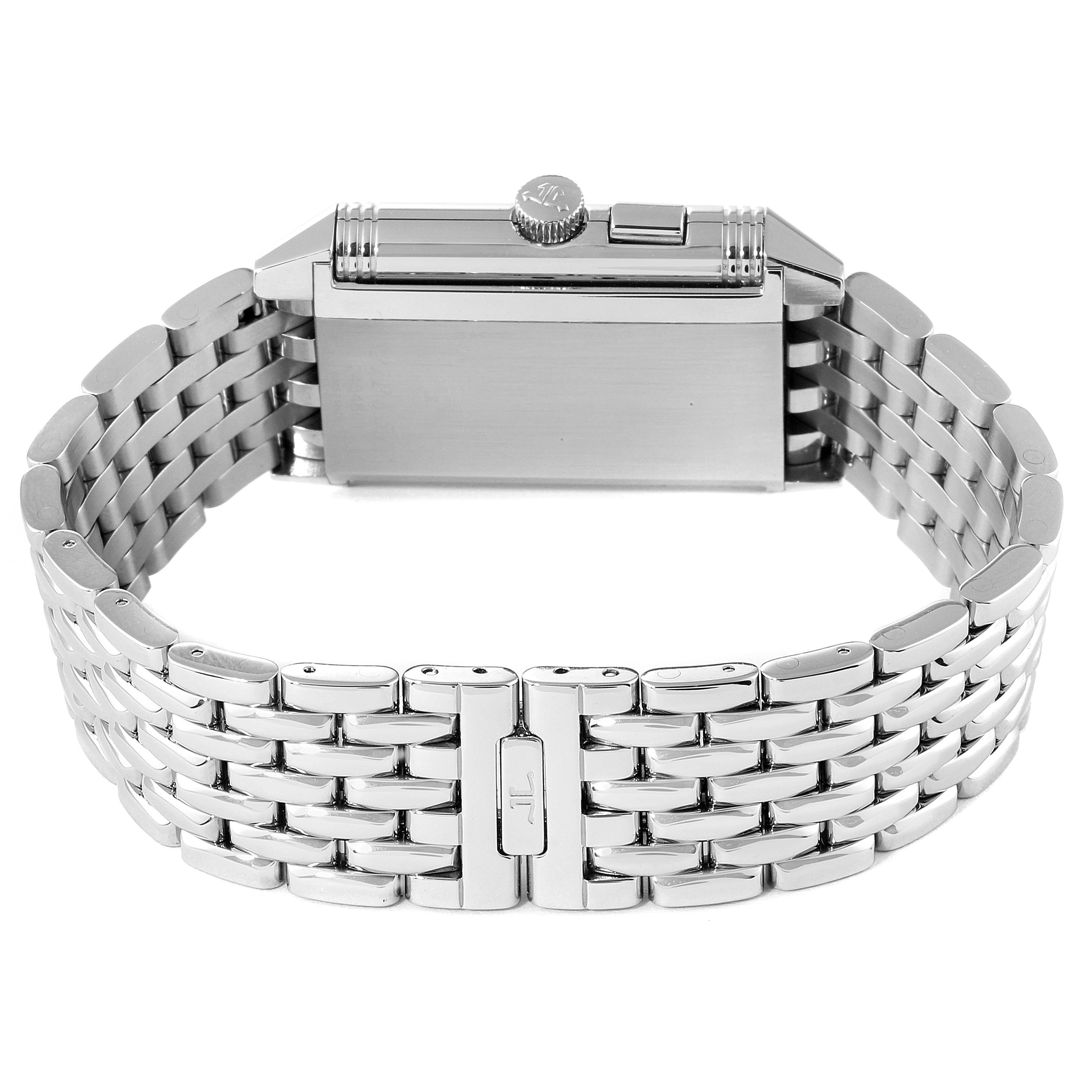 The Jaeger-LeCoultre Reverso watch is shown from the side, displaying its stainless steel case, crown, and bracelet.