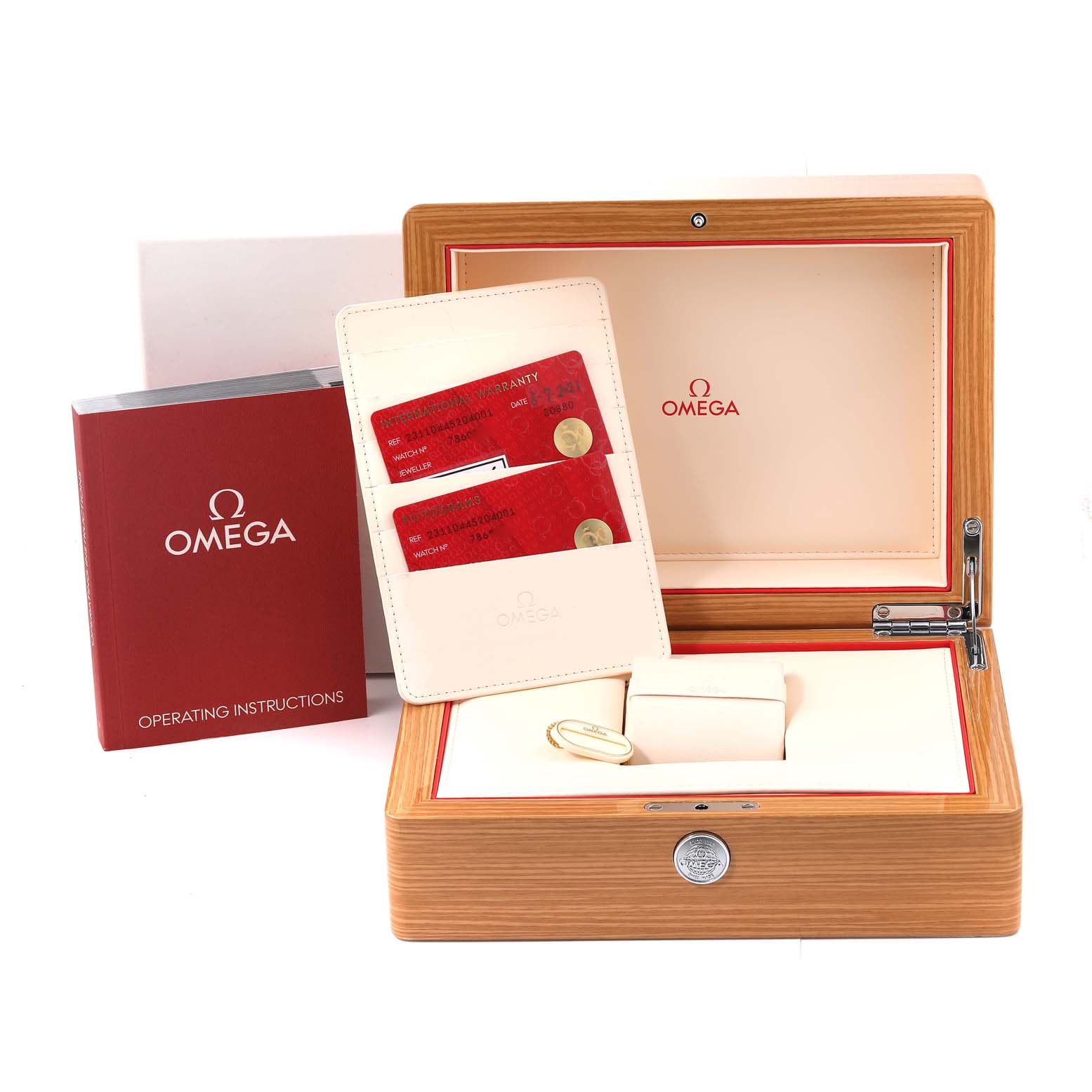 The image shows an open Omega Seamaster 231.10.44.52.04.001 Men
s Stainless Steel White Dial 231.10.44.52.04.001 Men
s Stainless Steel White Dial watch box, warranty cards, and an operating instructions booklet.