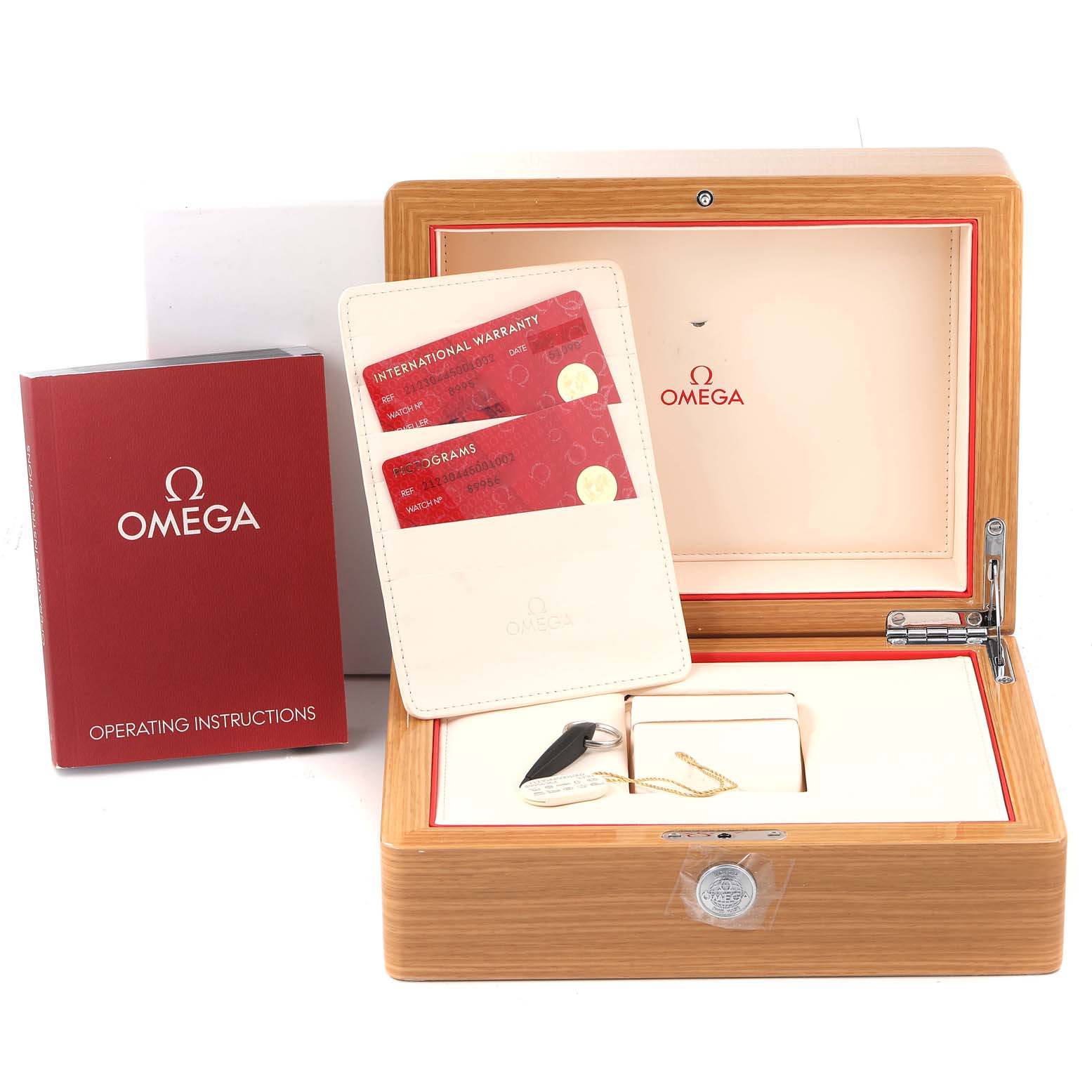 The image shows a wooden Omega Seamaster 212.30.44.50.01.002 Men's Stainless Steel Black Dial 212.30.44.50.01.002 Men's Stainless Steel Black Dial watch box, operating instructions, and warranty cards.