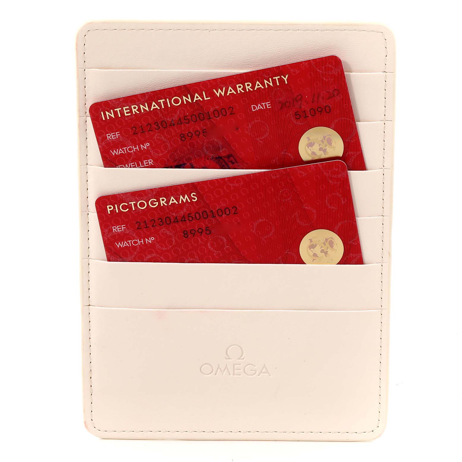 The image shows the international warranty and pictograms cards for the Omega Seamaster 212.30.44.50.01.002 Men's Stainless Steel Black Dial 212.30.44.50.01.002 Men's Stainless Steel Black Dial model in a white Omega cardholder.