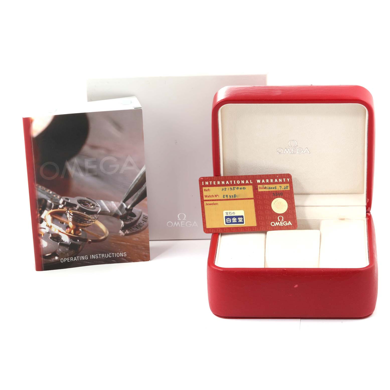 The image shows the operating instructions, warranty card, and a red Omega box for the Speedmaster model by Omega.