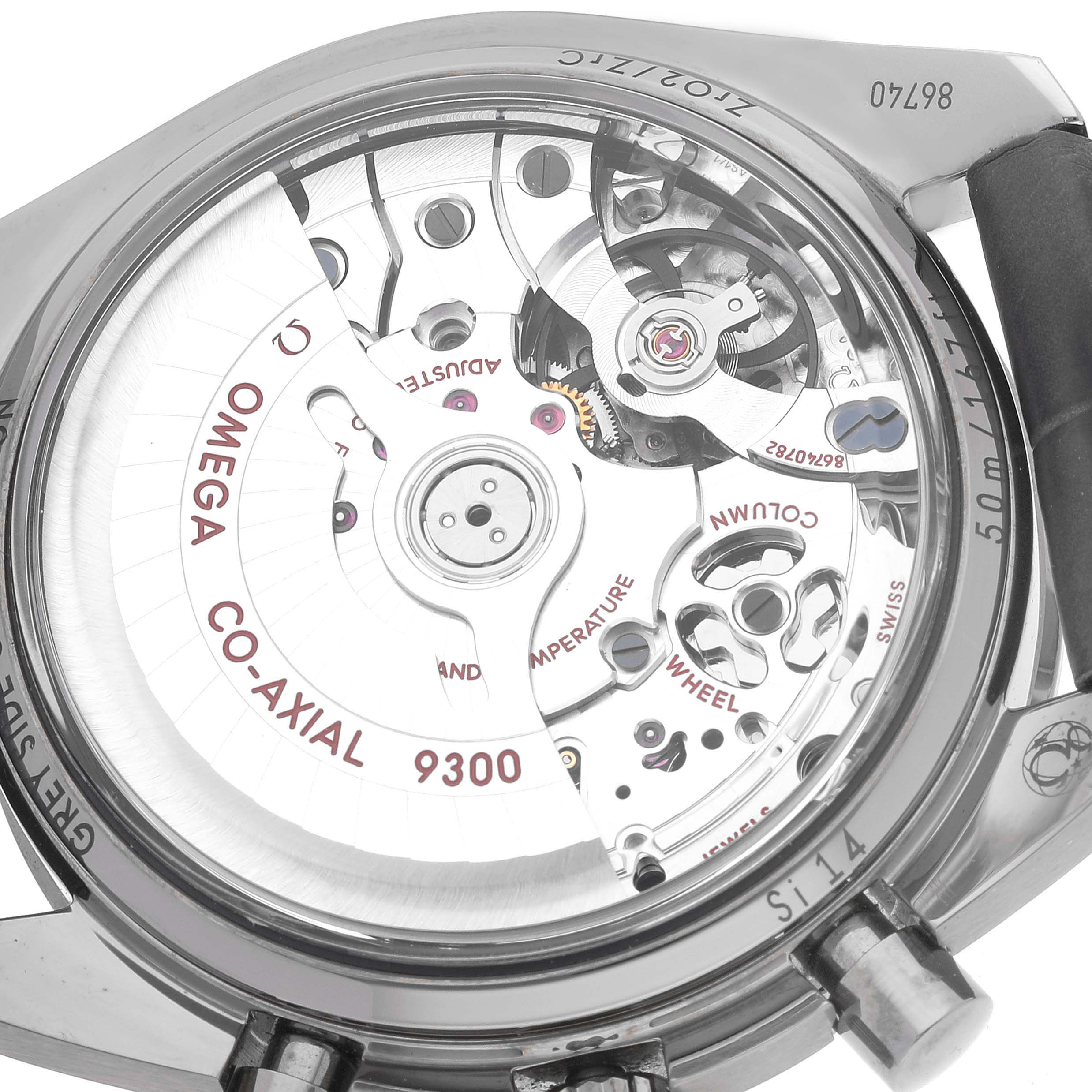 The image shows a close-up of the movement and inner mechanism of an Omega Speedmaster 311.93.44.51.99.001 Men's Ceramic Silver Dial 311.93.44.51.99.001 Men's Ceramic Silver Dial watch.