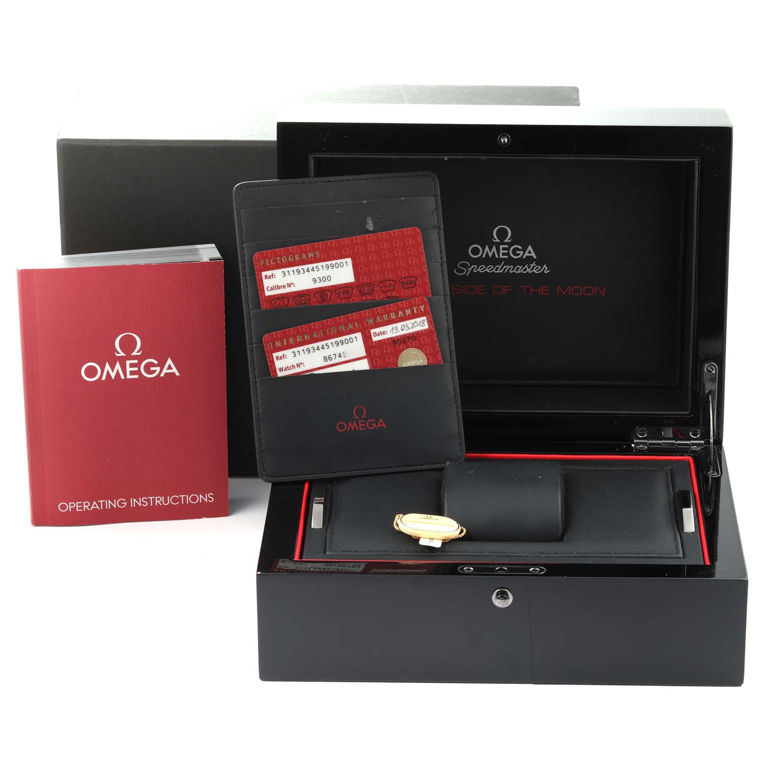 This image shows the Omega Speedmaster 311.93.44.51.99.001 Men's Ceramic Silver Dial 311.93.44.51.99.001 Men's Ceramic Silver Dial watch box, operating instructions, warranty cards, and its black case.