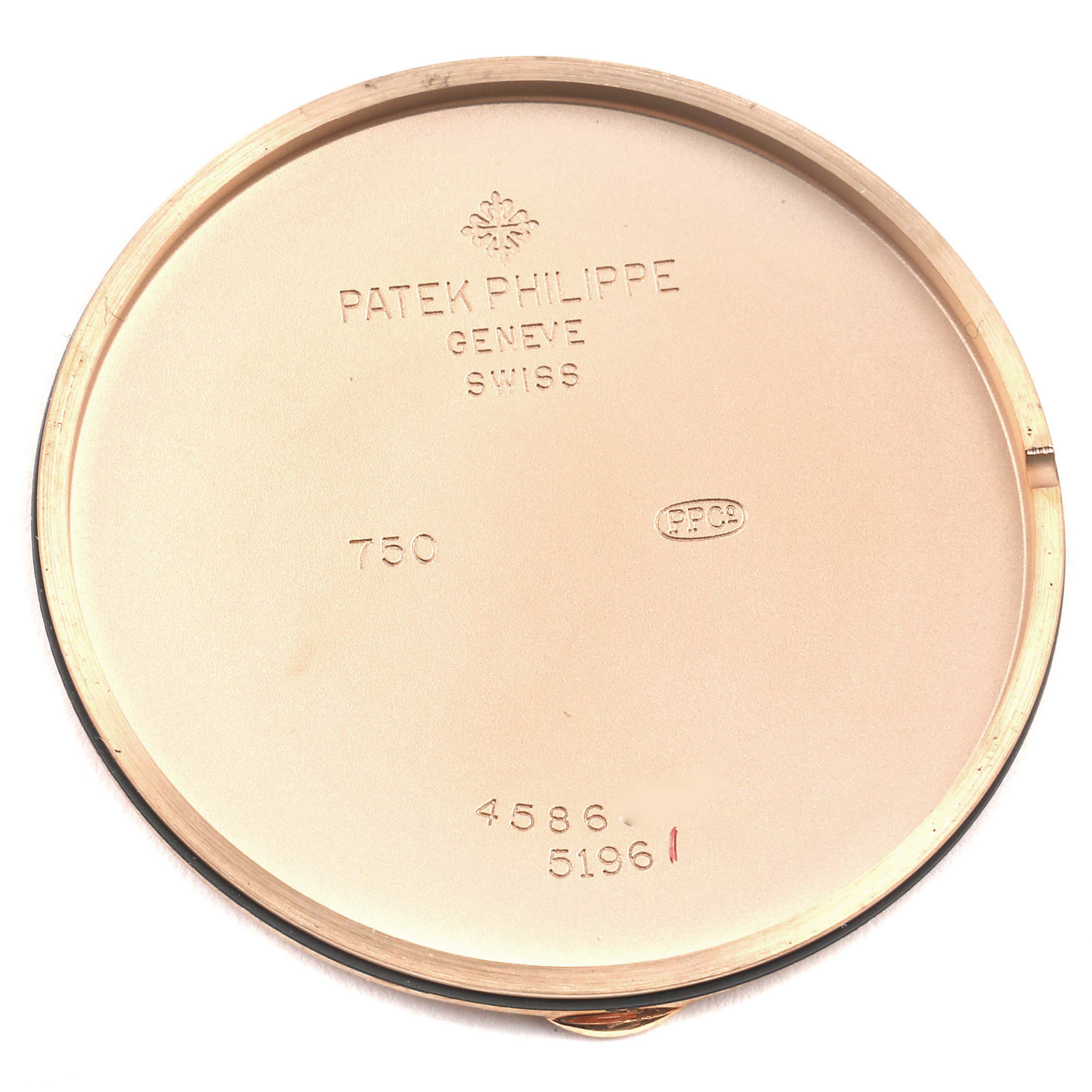 The image shows the inside case back of a Patek Philippe Calatrava 5196R Men
s Rose Gold Silver Dial 5196R Men
s Rose Gold Silver Dial watch, displaying brand engravings and model numbers.