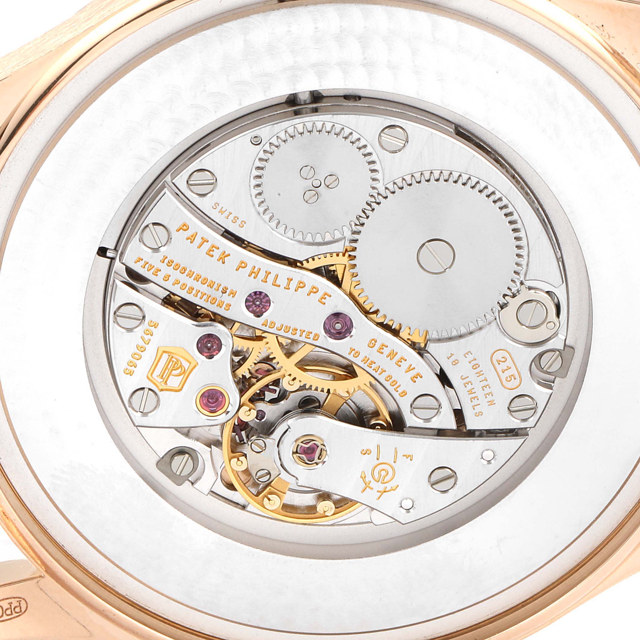 This image shows the inner mechanical movement of a Patek Philippe Calatrava 5196R Men
s Rose Gold Silver Dial 5196R Men
s Rose Gold Silver Dial watch from a close-up angle.