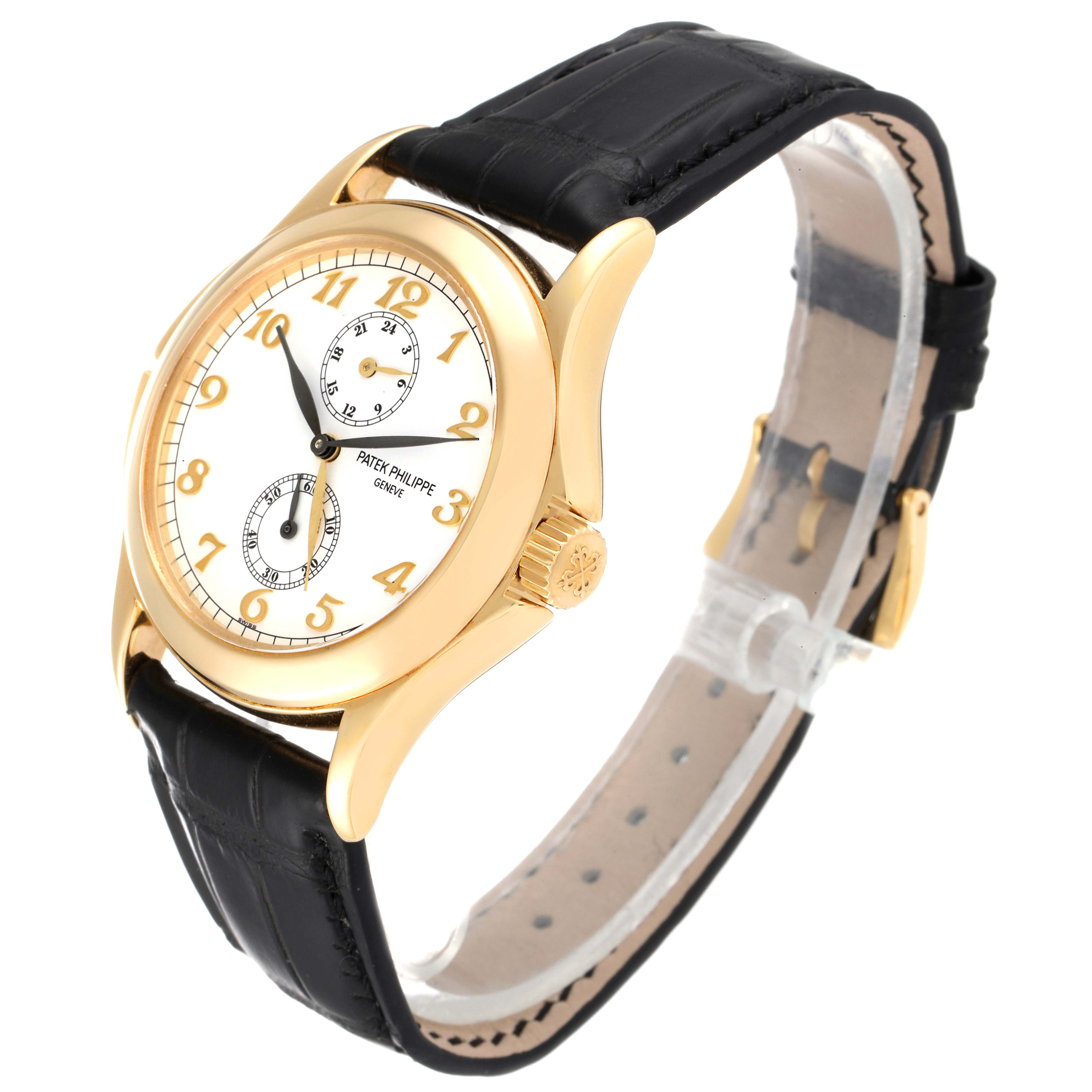 The Patek Philippe Calatrava 5134J Men's Yellow Gold White Dial 5134J Men's Yellow Gold White Dial watch is shown at a three-quarter angle, displaying its face, crown, and black leather strap.