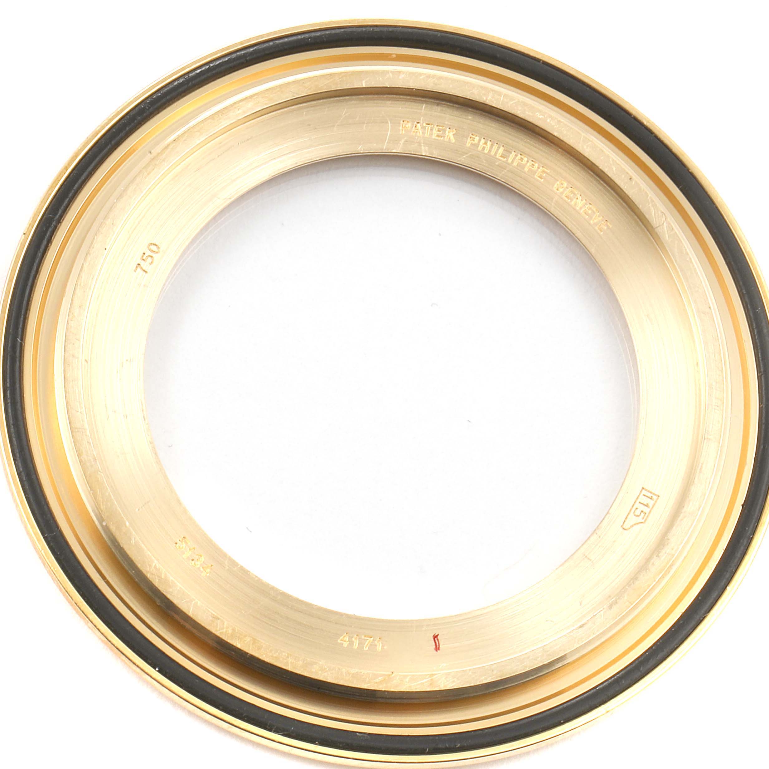 This image shows the gold bezel for a Calatrava model watch by Patek Philippe, viewed from above.