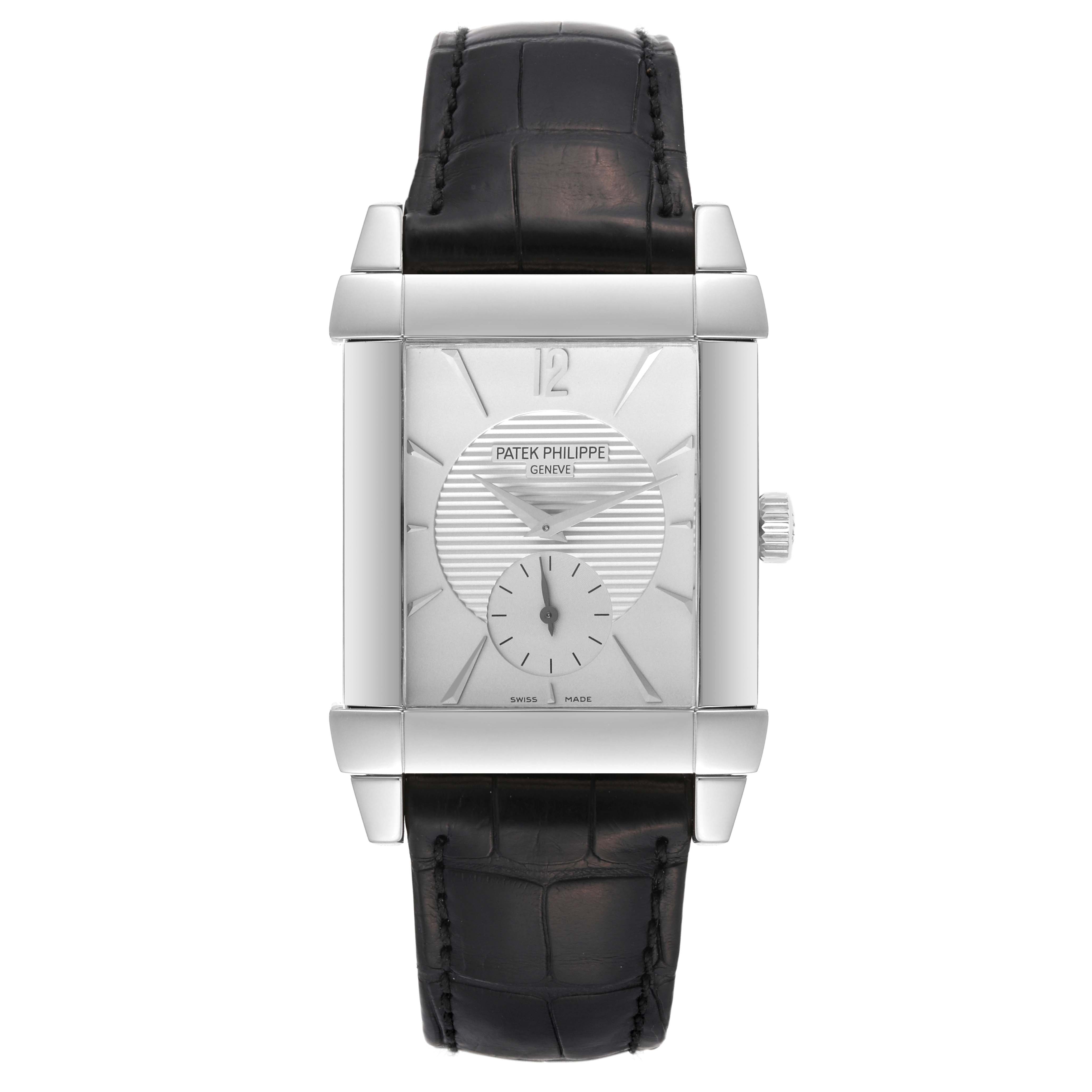 The image shows a front view of the Patek Philippe Gondolo 5111G-001 Men's White Gold Silver Dial 5111G-001 Men's White Gold Silver Dial watch, highlighting its rectangular face and black leather strap.