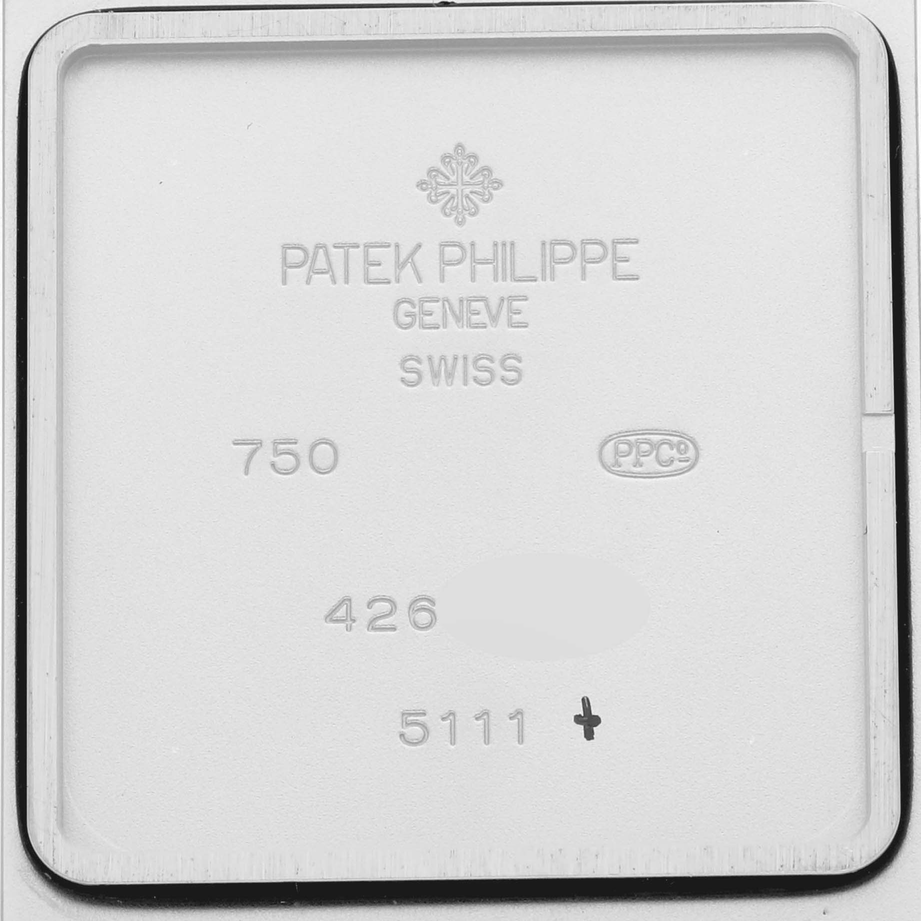 This image shows the back interior case of a Patek Philippe Gondolo 5111G-001 Men's White Gold Silver Dial 5111G-001 Men's White Gold Silver Dial watch, displaying branding and model details.