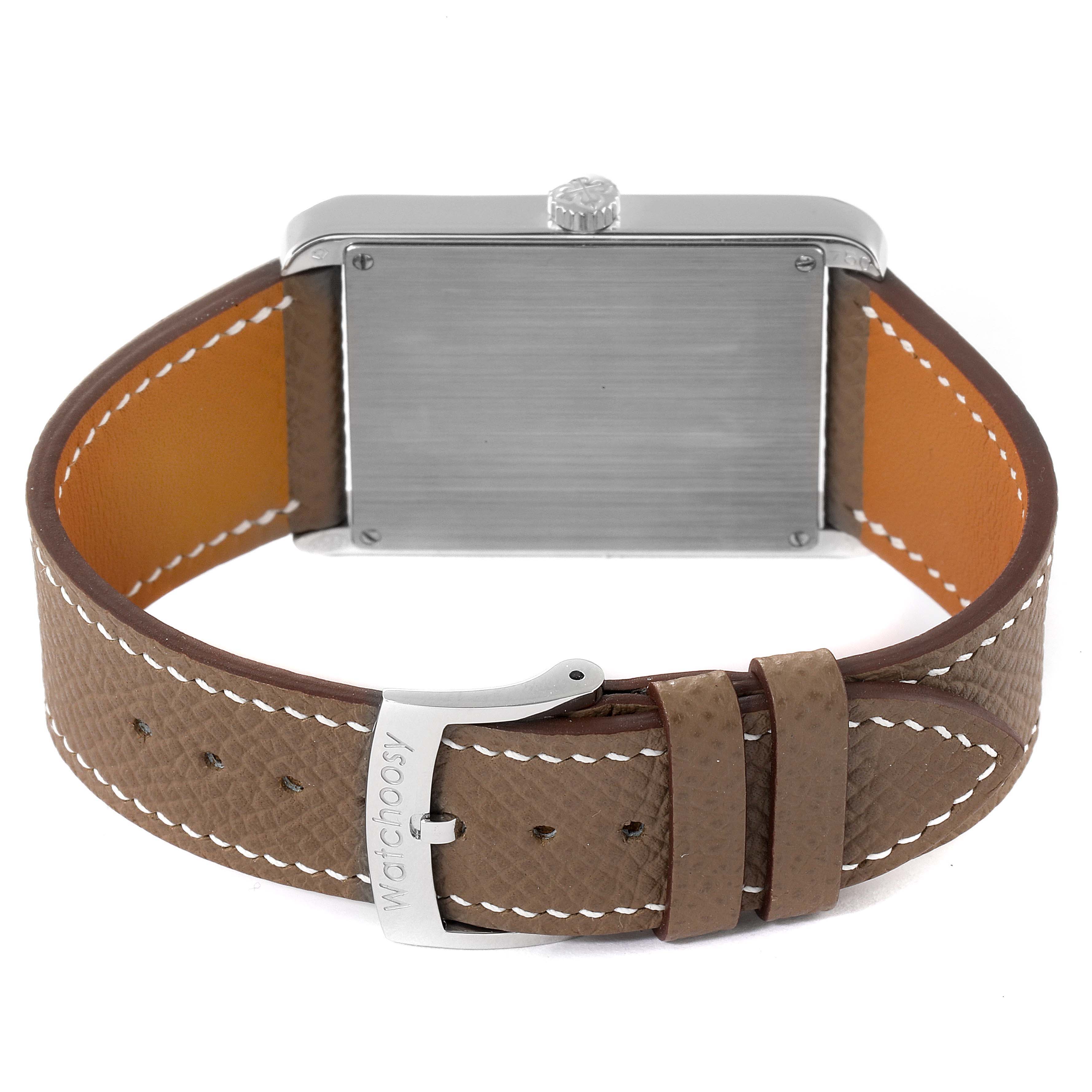 The image shows the back view of the Patek Philippe Gondolo 5109G Men's White Gold Silver Dial 5109G Men's White Gold Silver Dial watch, highlighting its case, crown, and brown leather strap with stitching.