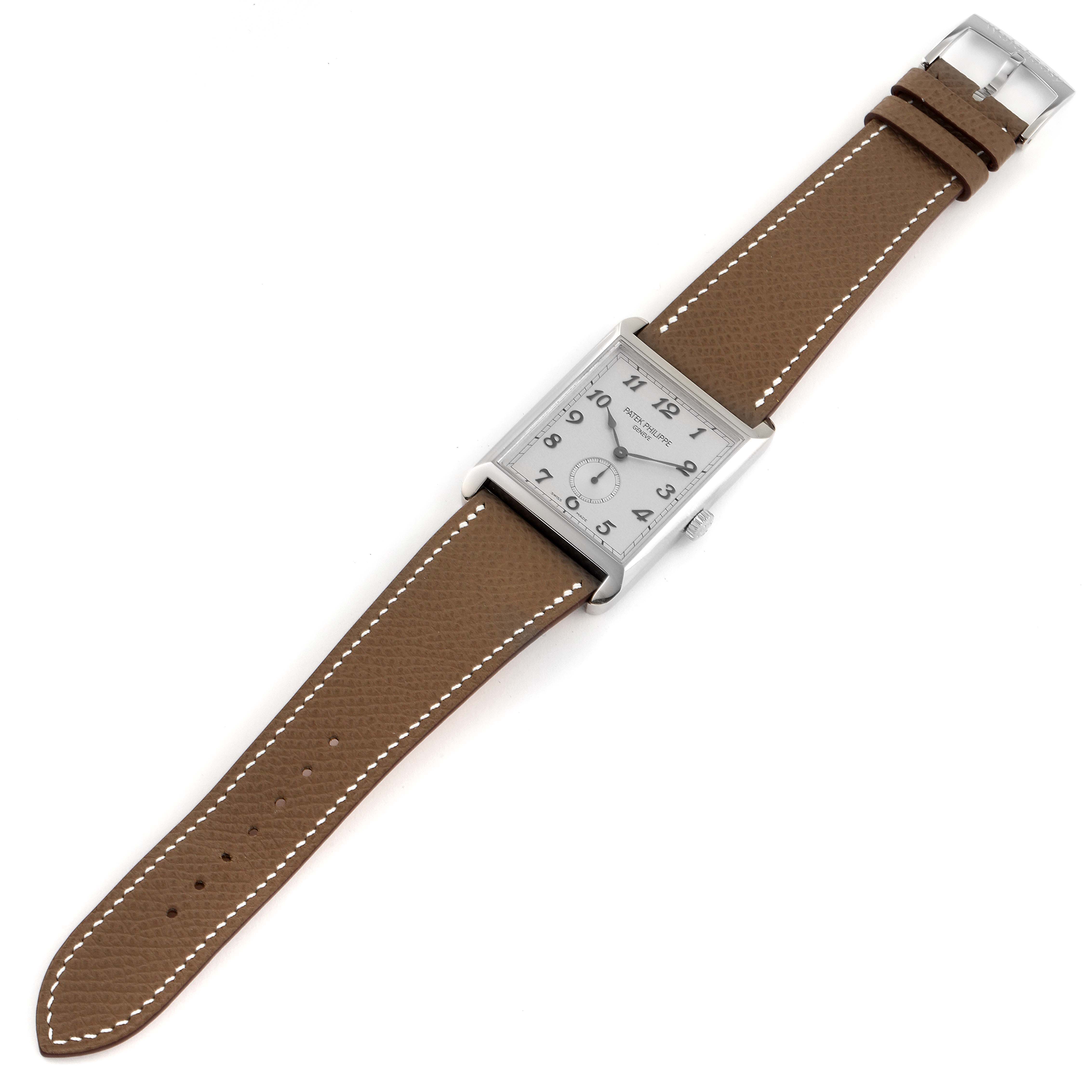 This image shows a Patek Philippe Gondolo 5109G Men's White Gold Silver Dial 5109G Men's White Gold Silver Dial watch from a top-down angle, highlighting its rectangular case, dial, and brown leather strap.