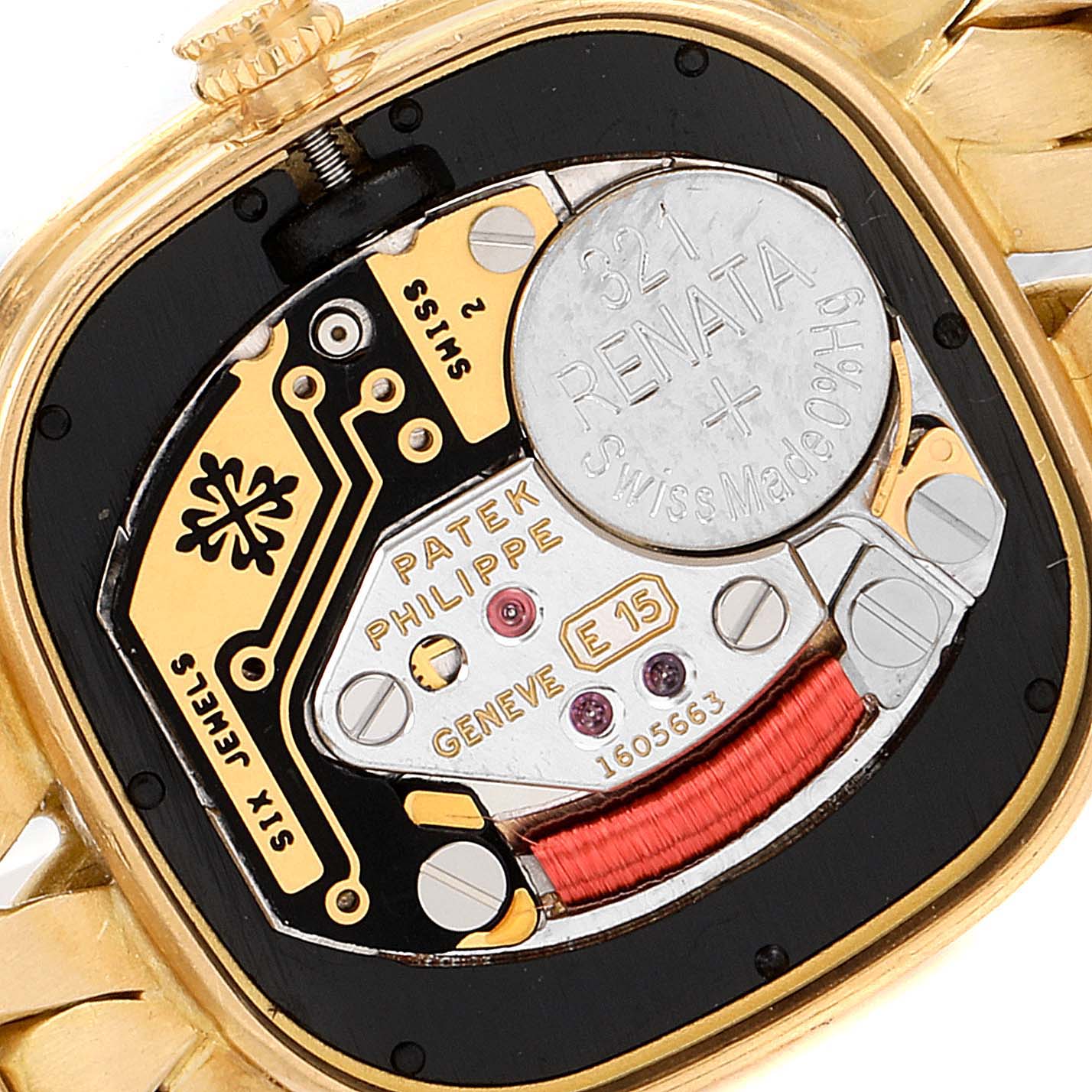 This image shows the back view of the Patek Philippe La Flamme  4715J Women's Yellow Gold Silver Dial 4715J Women's Yellow Gold Silver Dialmodel, featuring its intricate internal mechanisms and battery compartment.