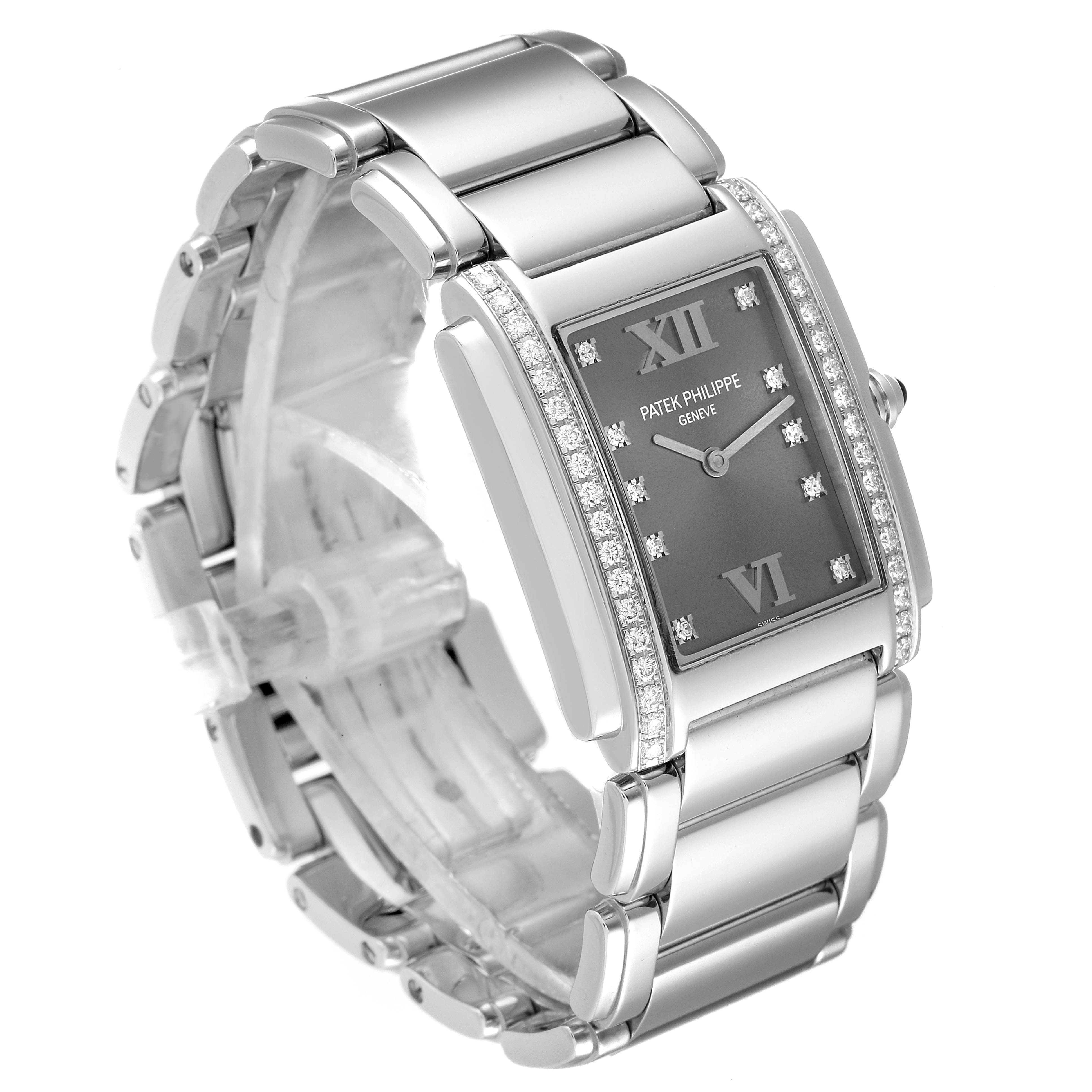 This image shows a Patek Philippe Twenty-4 4910/10A-010 Women's Stainless Steel Grey Dial 4910/10A-010 Women's Stainless Steel Grey Dial watch at a 3/4 angle, highlighting its face, bezel, and bracelet.