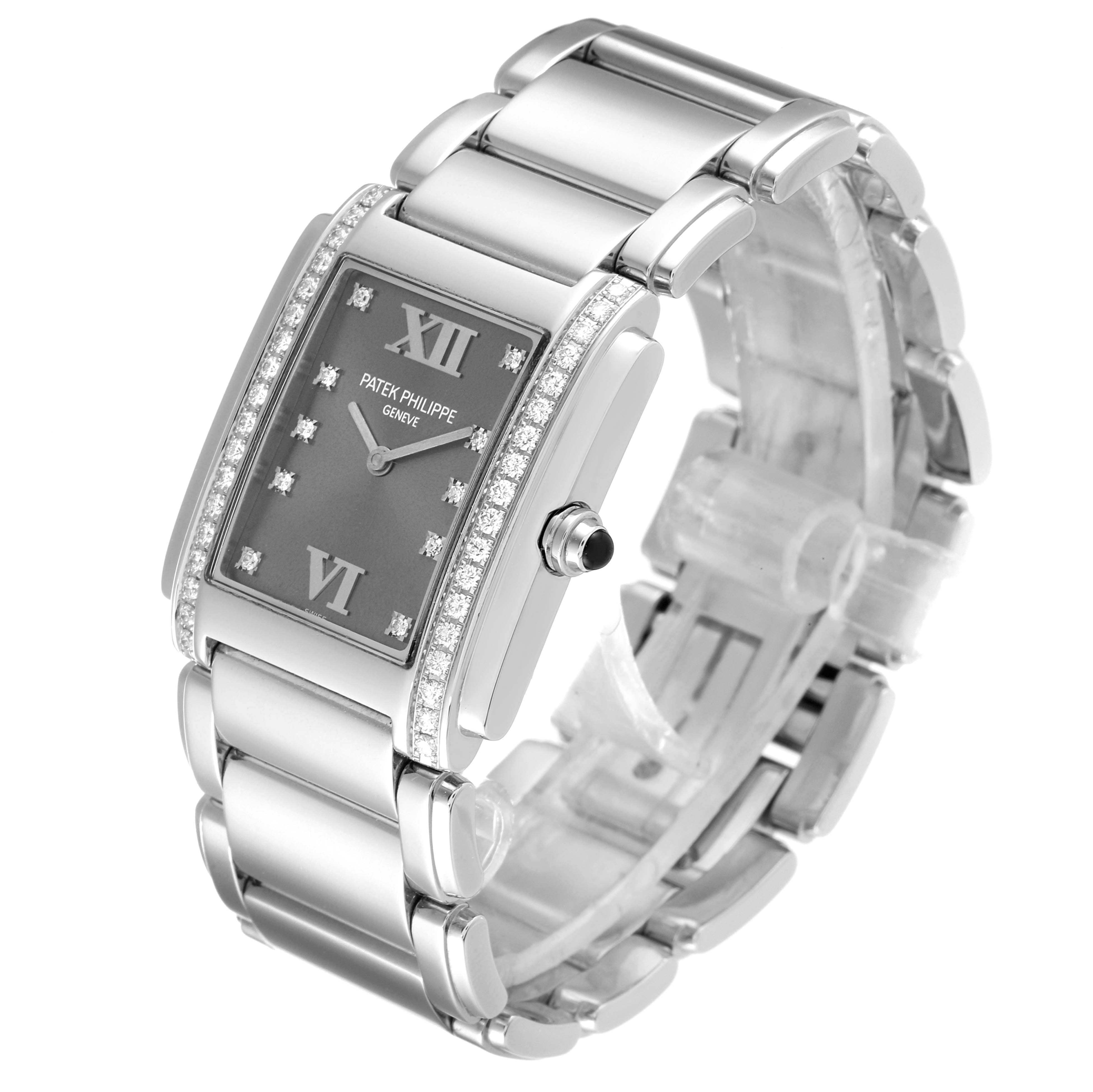 The image shows a side angle view of the Patek Philippe Twenty-4 4910/10A-010 Women's Stainless Steel Grey Dial 4910/10A-010 Women's Stainless Steel Grey Dial watch, highlighting its rectangular face, diamond accents, and metal bracelet.