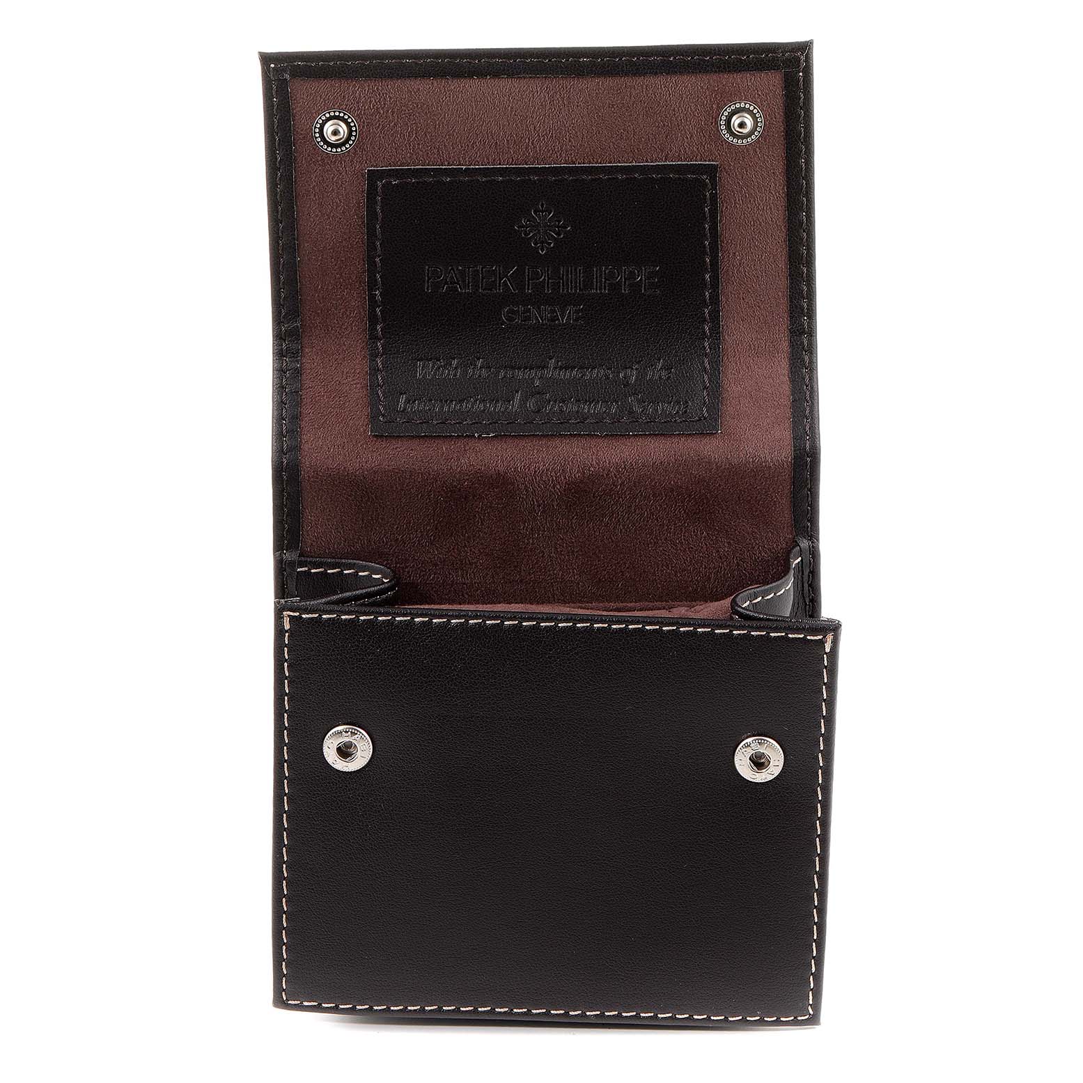 This is an image of a Patek Philippe Twenty-4 4910/10A-010 Women's Stainless Steel Grey Dial 4910/10A-010 Women's Stainless Steel Grey Dial watch case, shown open from the front, displaying the brand's logo inside.